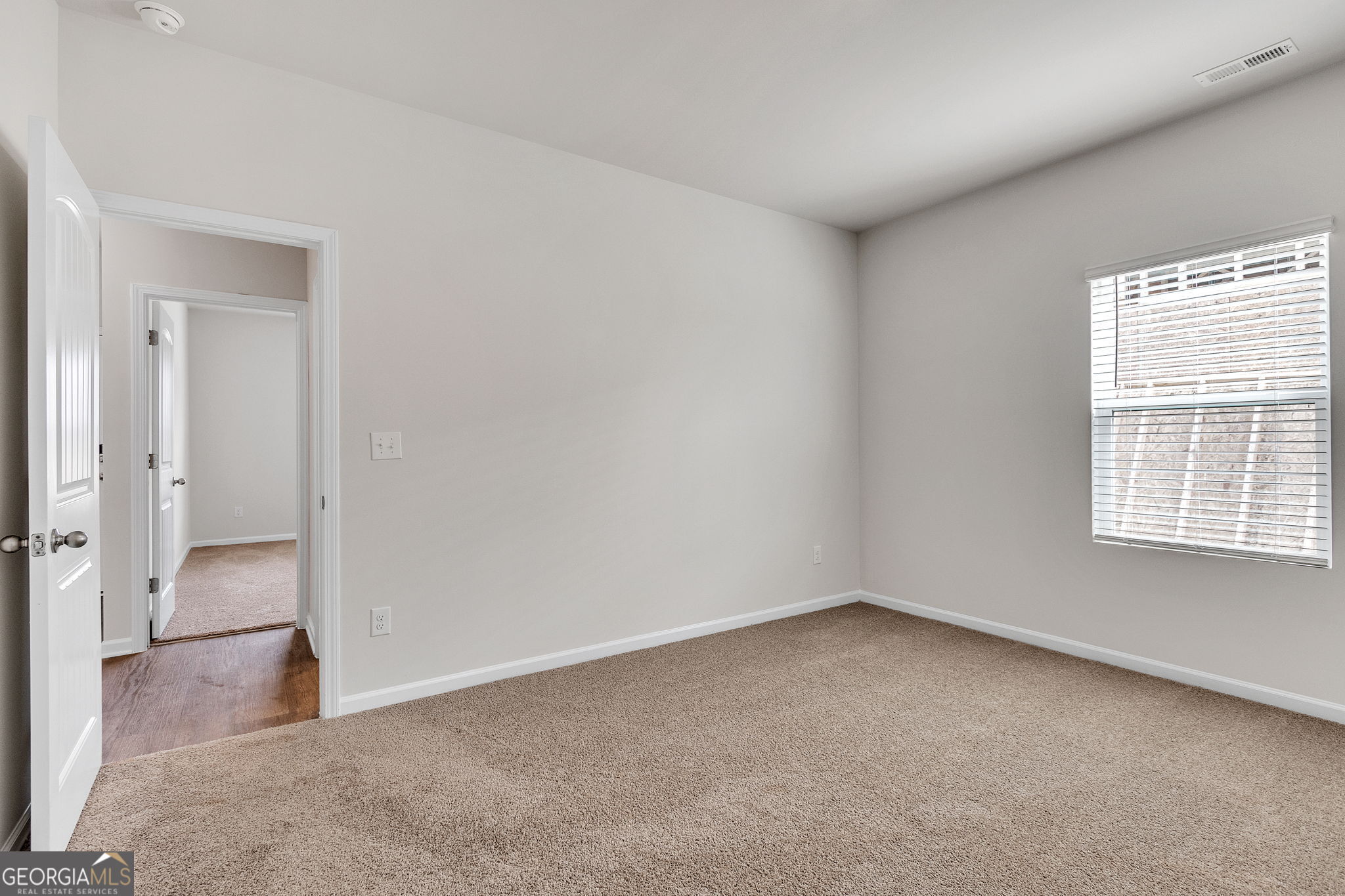 506 Holsteiner Road, Unit 64 Hogansville, GA 30230 - Photo 12 of 21 wooden floor and windows in an empty room
