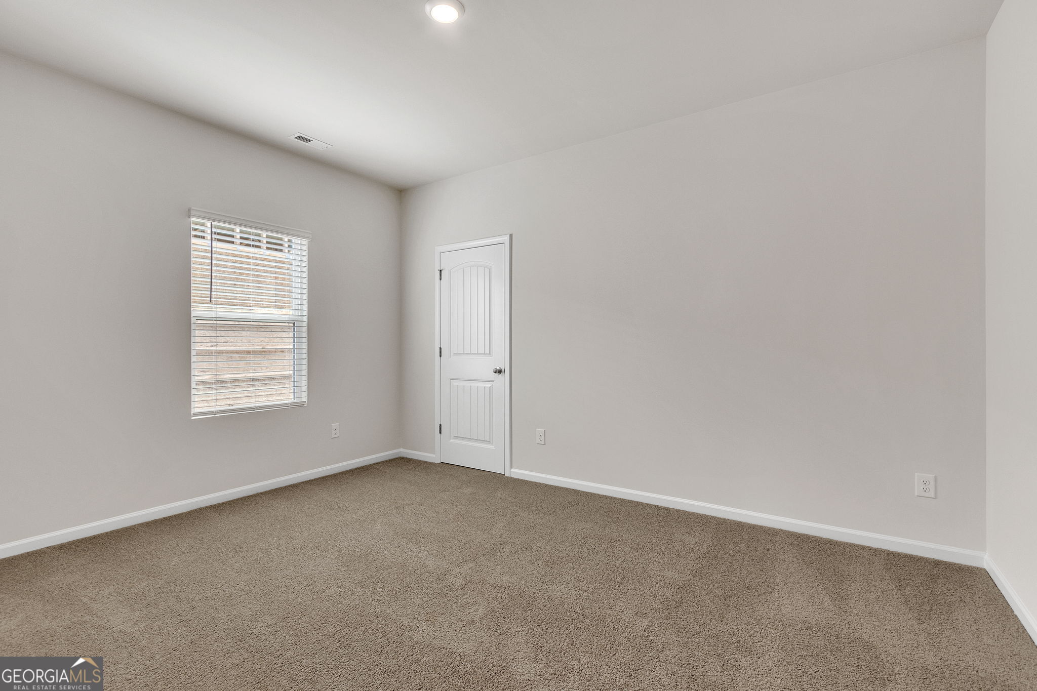 506 Holsteiner Road, Unit 64 Hogansville, GA 30230 - Photo 13 of 21 an empty room with a window