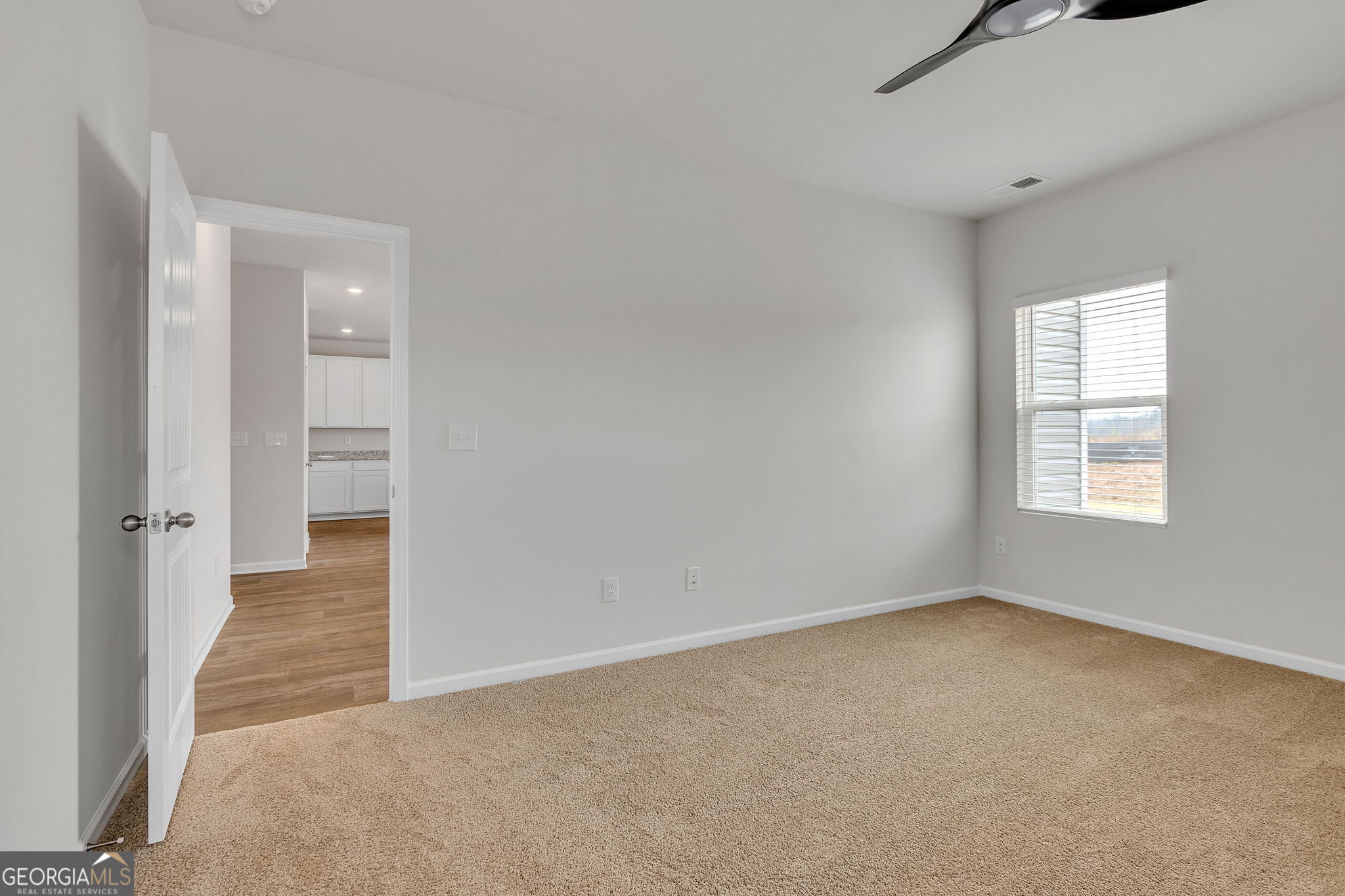 506 Holsteiner Road, Unit 64 Hogansville, GA 30230 - Photo 17 of 21 an empty room with windows and entrance