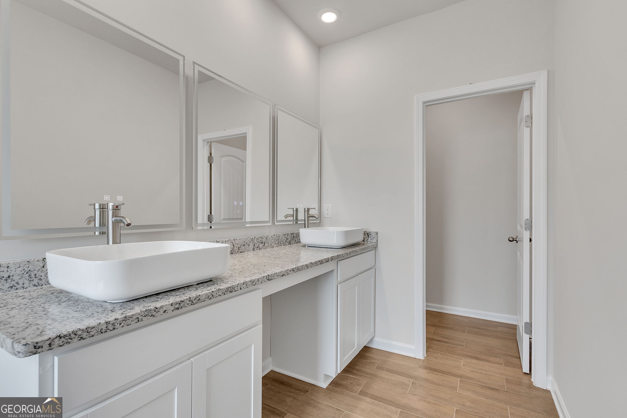 506 Holsteiner Road, Unit 64 Hogansville, GA 30230 - Photo 20 of 21 a bathroom with a granite countertop sink and a mirror