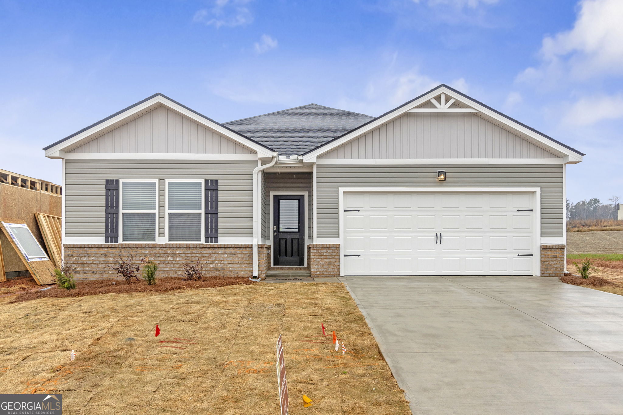 506 Holsteiner Road, Unit 64 Hogansville, GA 30230 - Photo 2 of 21 a front view of a house with a yard and garage
