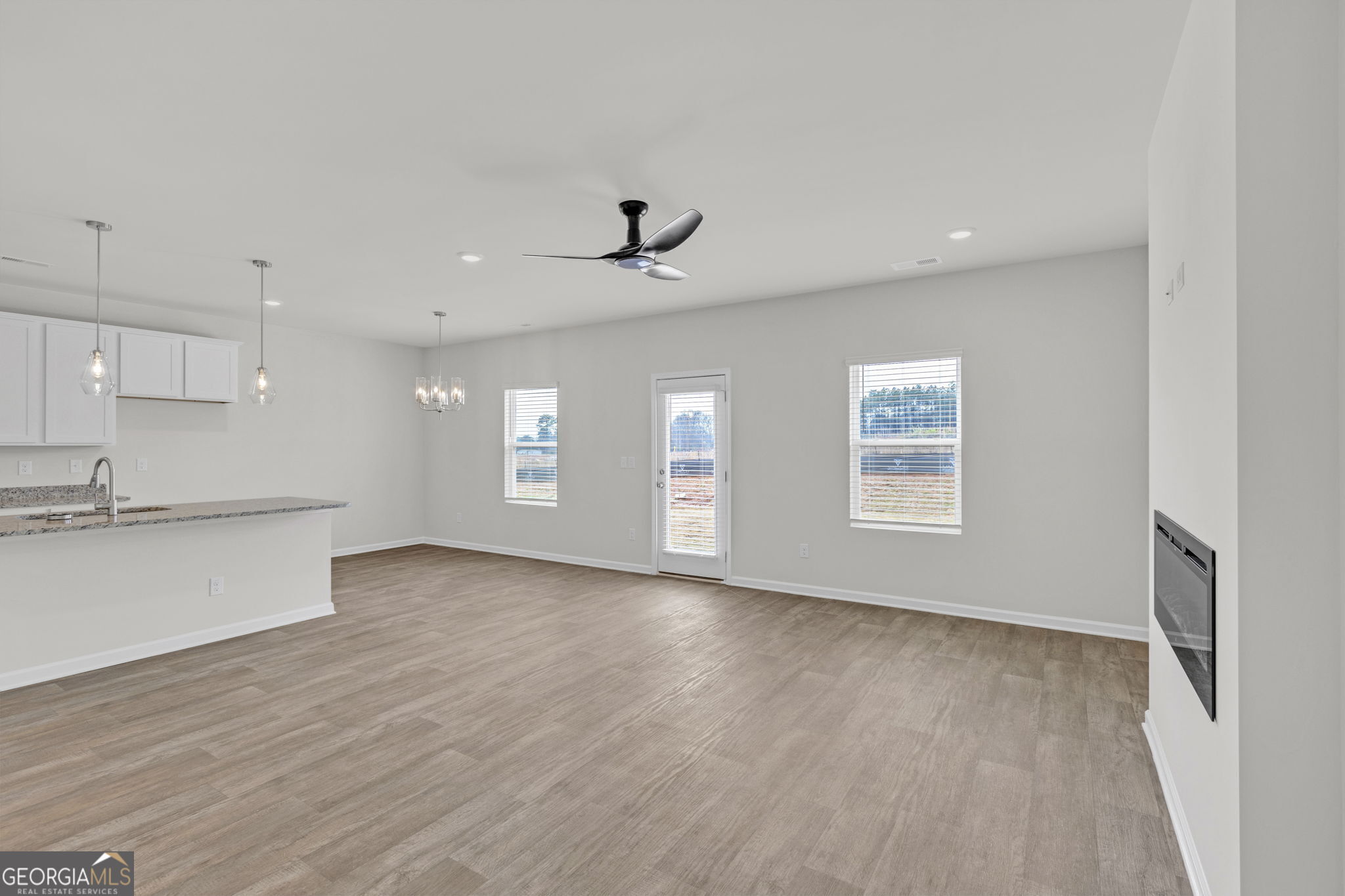 506 Holsteiner Road, Unit 64 Hogansville, GA 30230 - Photo 4 of 21 a view of an empty room with window and wooden floor