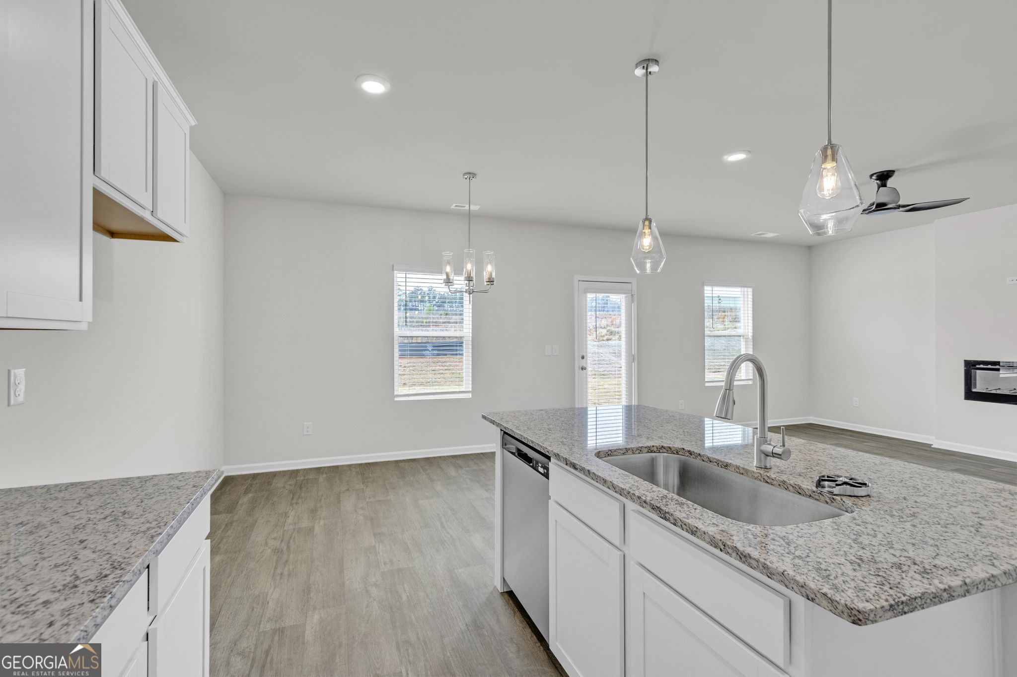 506 Holsteiner Road, Unit 64 Hogansville, GA 30230 - Photo 8 of 21 a kitchen with kitchen island a sink a counter space and appliances