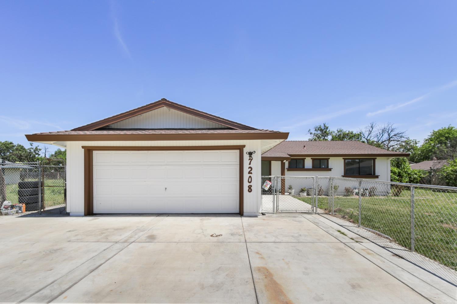 7208 7th Street Rio Linda, CA 95673 - Photo 40 of 41 a front view of a house with a yard and garage