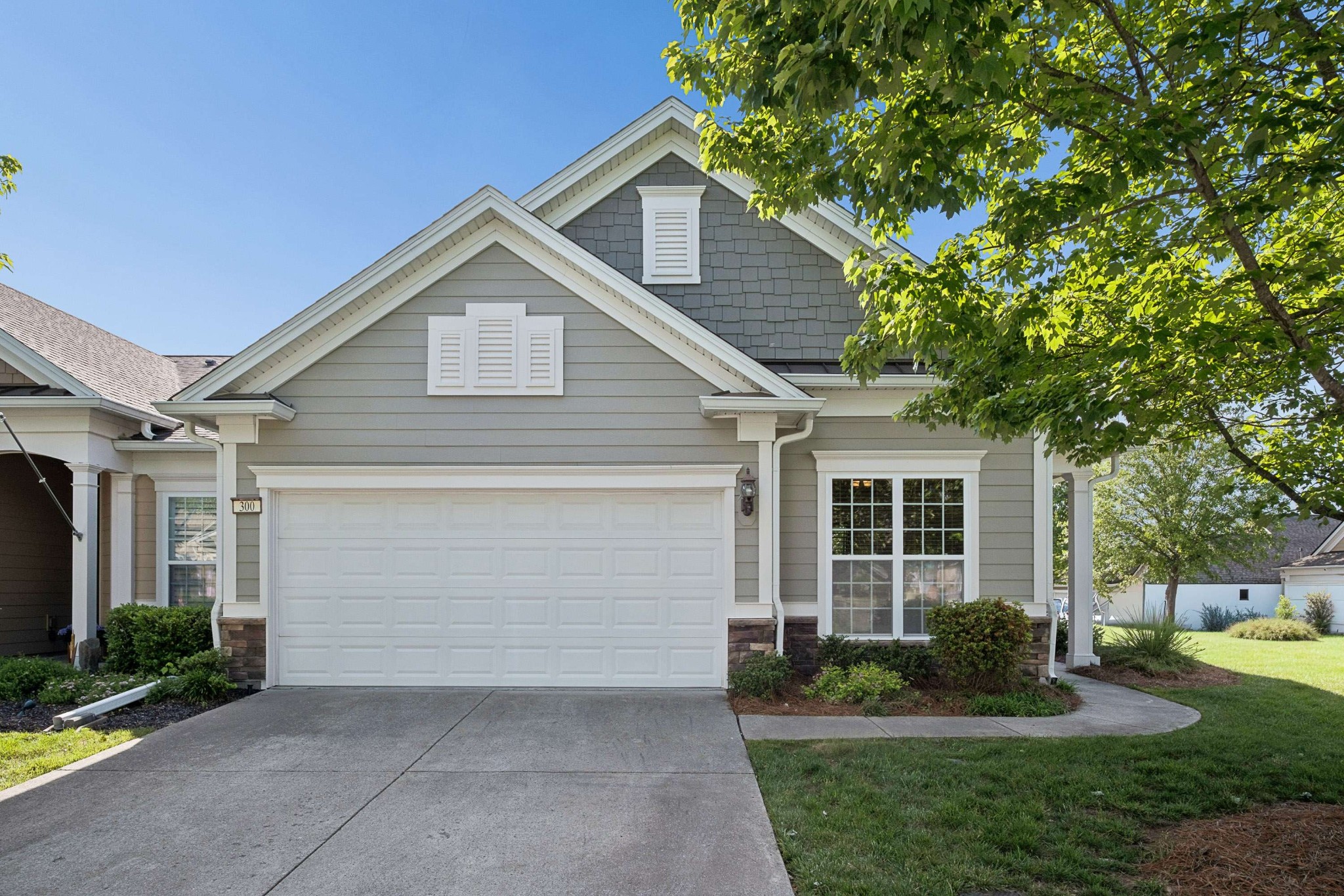 300 Blockade Lane Mount Juliet, TN 37122 - Photo 1 of 36 a front view of a house with a yard and garage