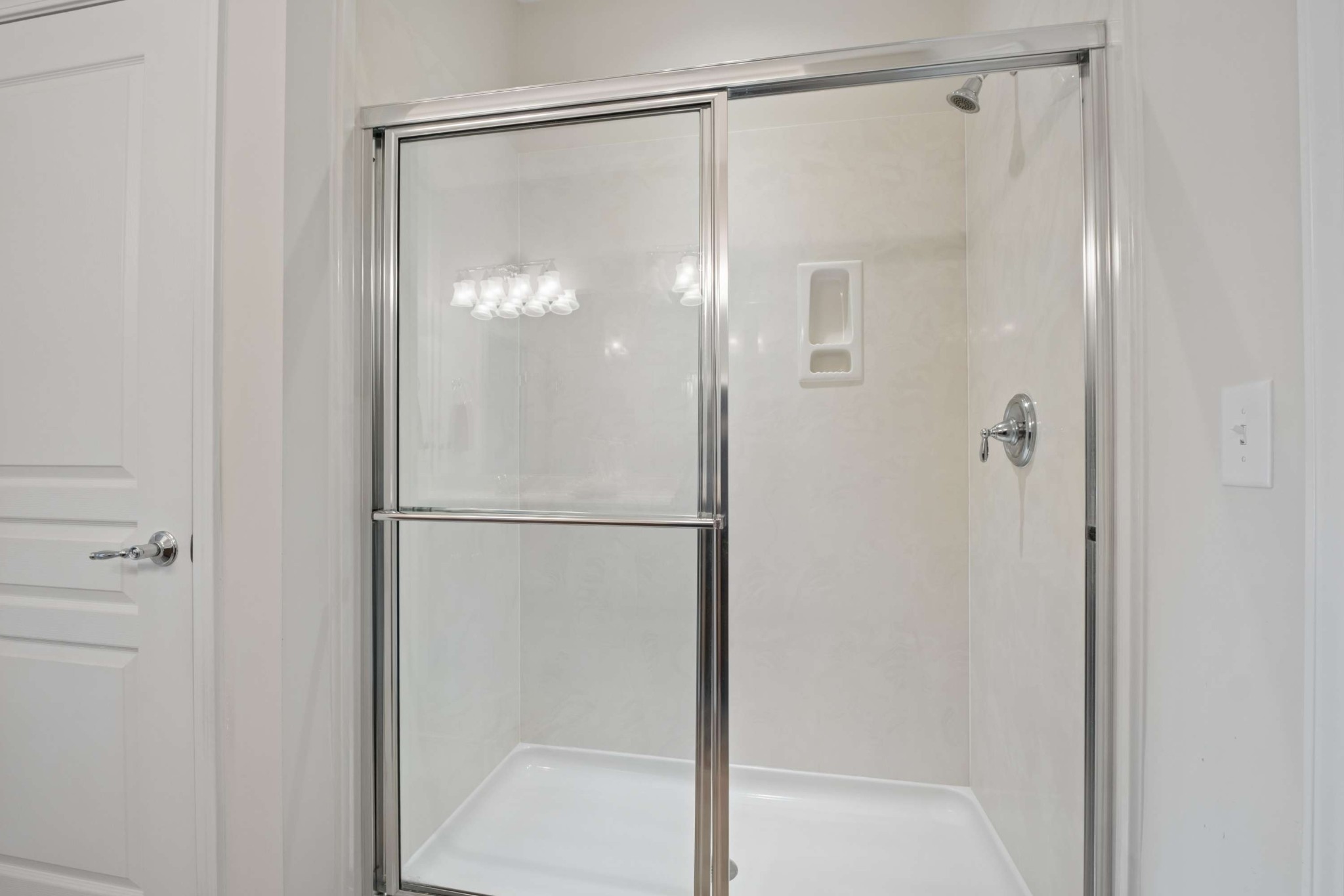 300 Blockade Lane Mount Juliet, TN 37122 - Photo 25 of 36 a bathroom with a glass shower door