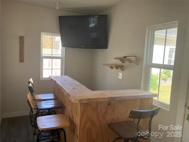 a room with a table and windows