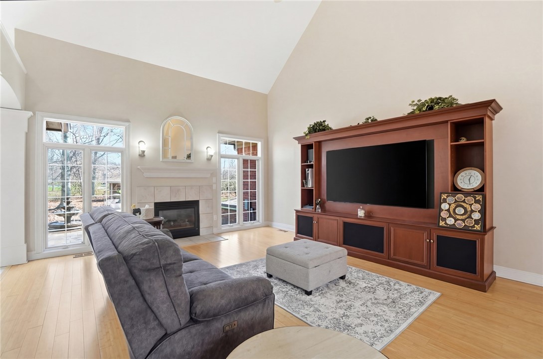 472 Timber Walk Court Springboro, OH 45066 - Photo 5 of 86 This living area features a fireplace and outdoor views, perfect for relaxation and entertaining.
