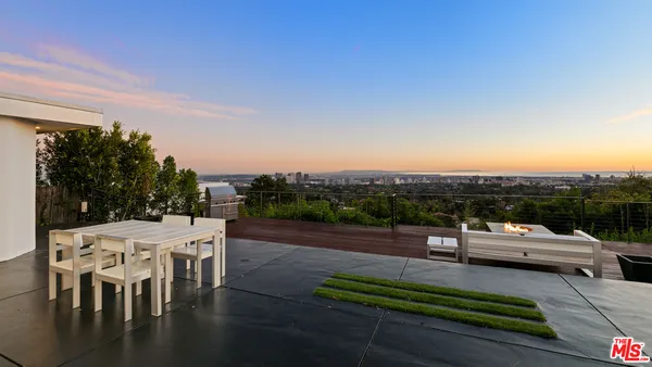 an outdoor sitting area with furniture