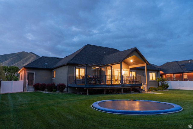 646 East 1400th Street North Mapleton, UT 84664 - Photo 62 of 78 Expansive green lawn with a large, in-ground trampoline