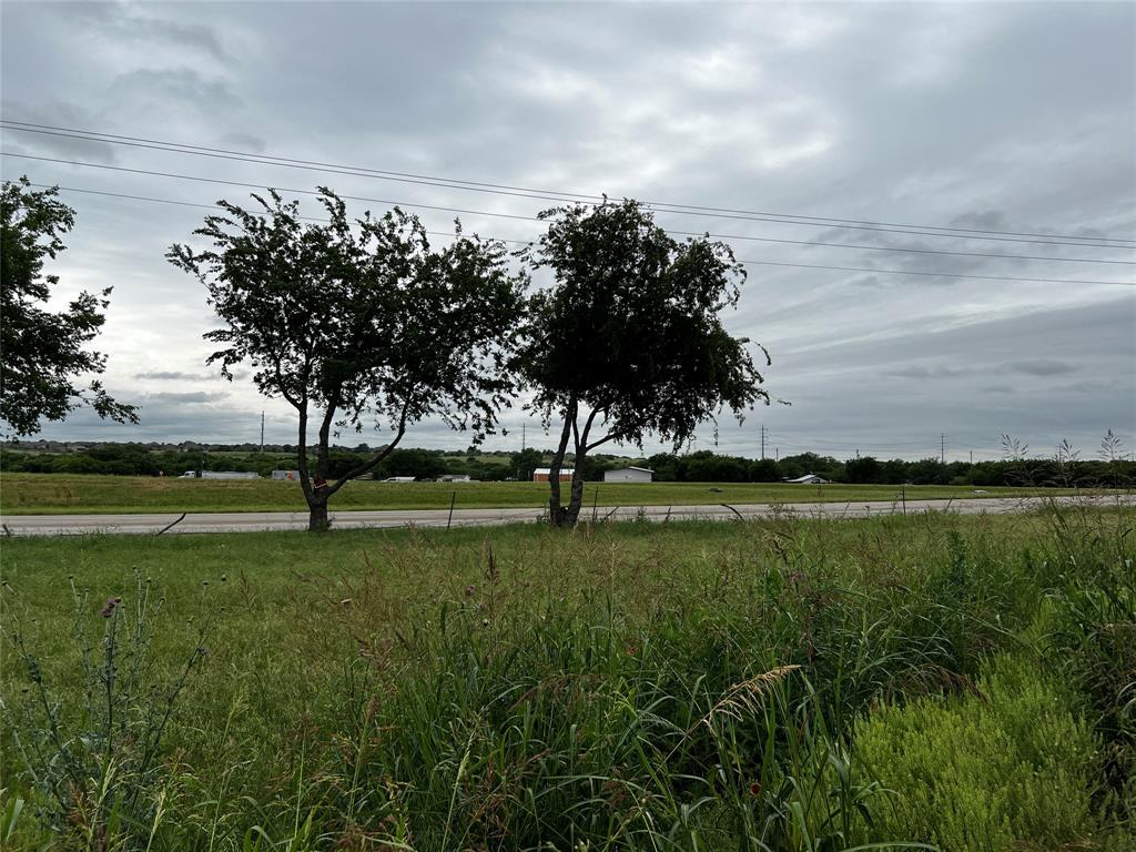 13501 Bates Aston Road Haslet, TX 76052 - Photo 3 of 4 a view of a golf course with a lake