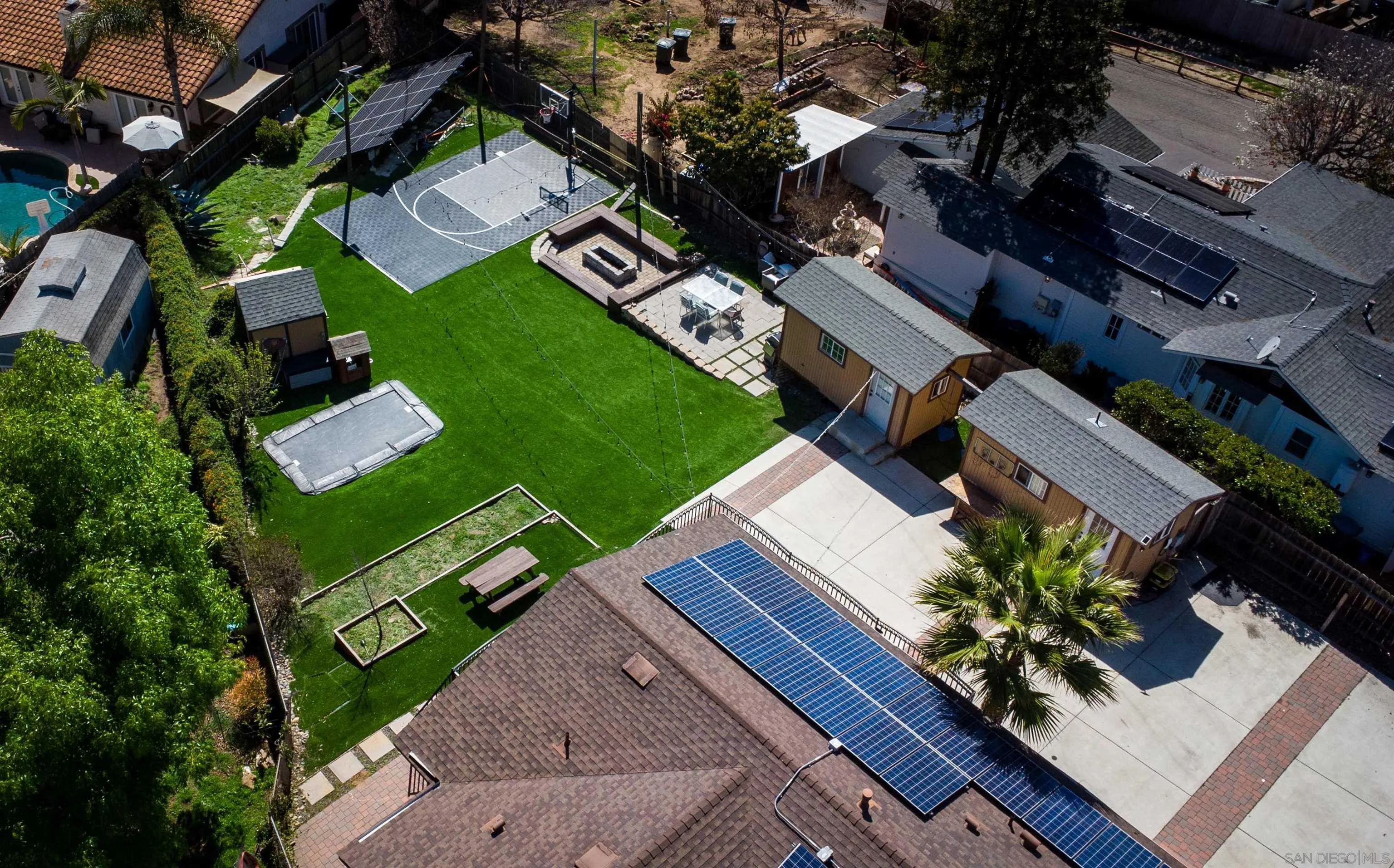 an aerial view of a house with a garden
