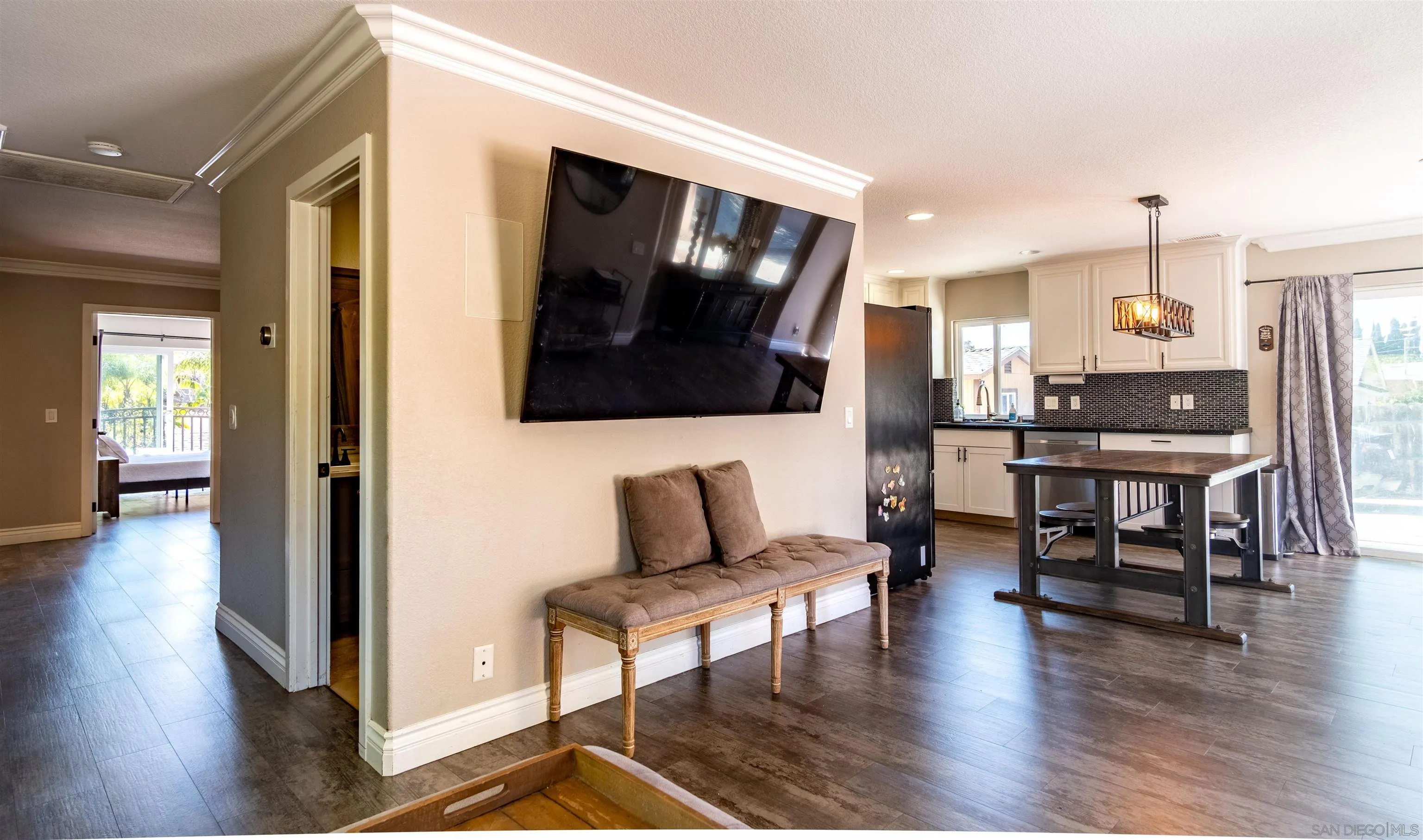 853 Crescent Drive Vista, CA 92084 - Photo 12 of 70 a living room with furniture and a flat screen tv
