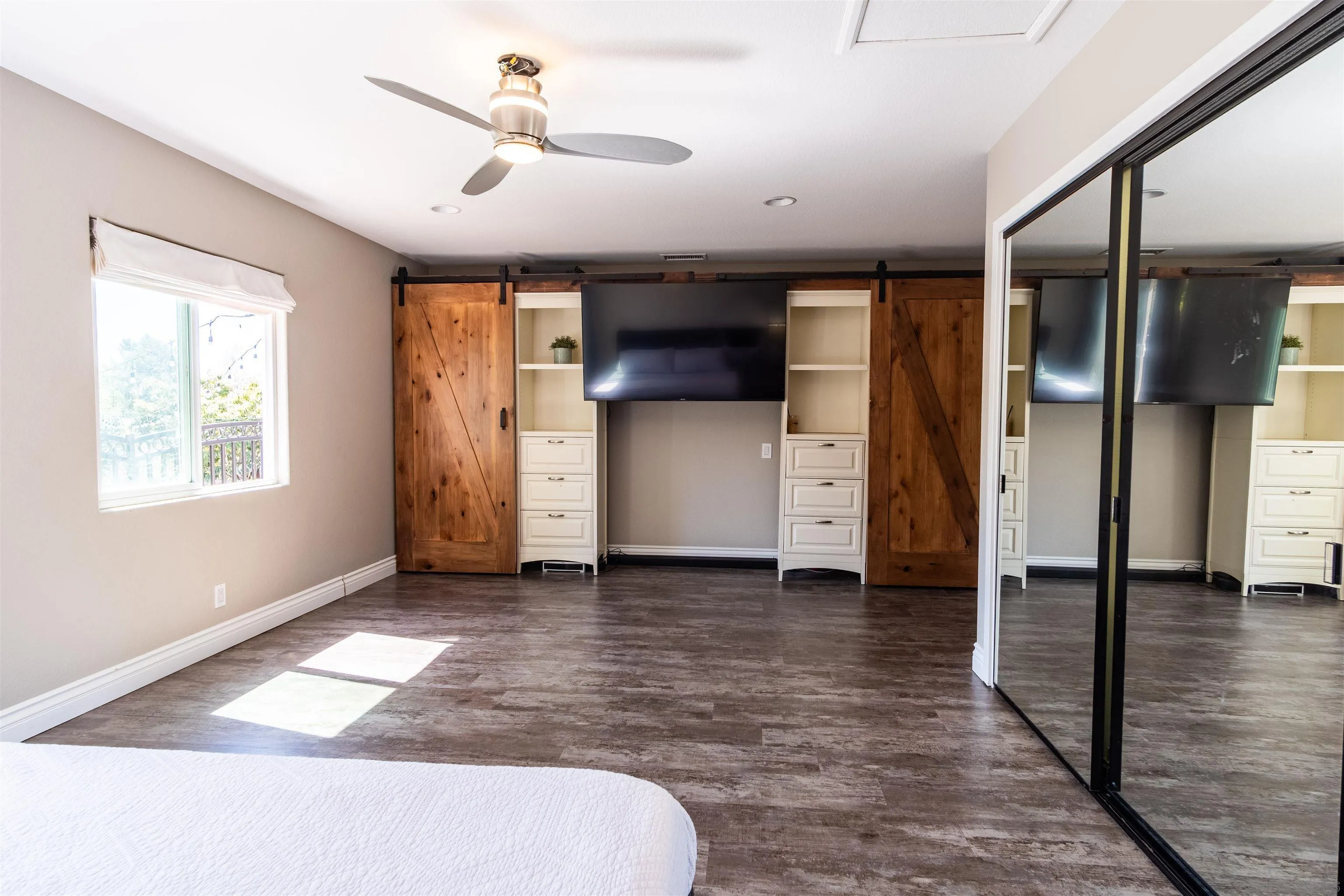 853 Crescent Drive Vista, CA 92084 - Photo 19 of 70 a view of hallway with a window and a ceiling fan