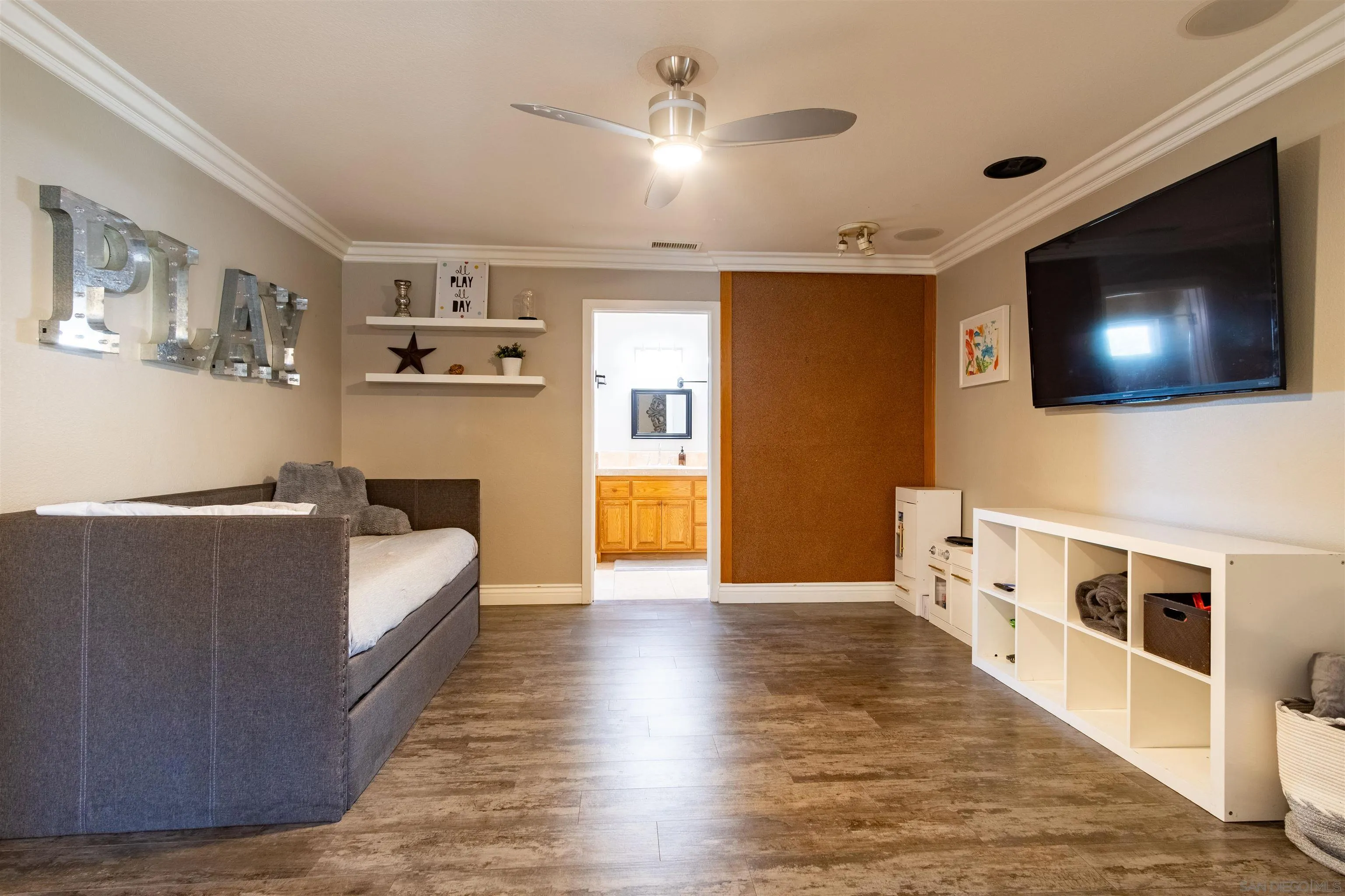 853 Crescent Drive Vista, CA 92084 - Photo 21 of 70 a living room with furniture and a flat screen tv