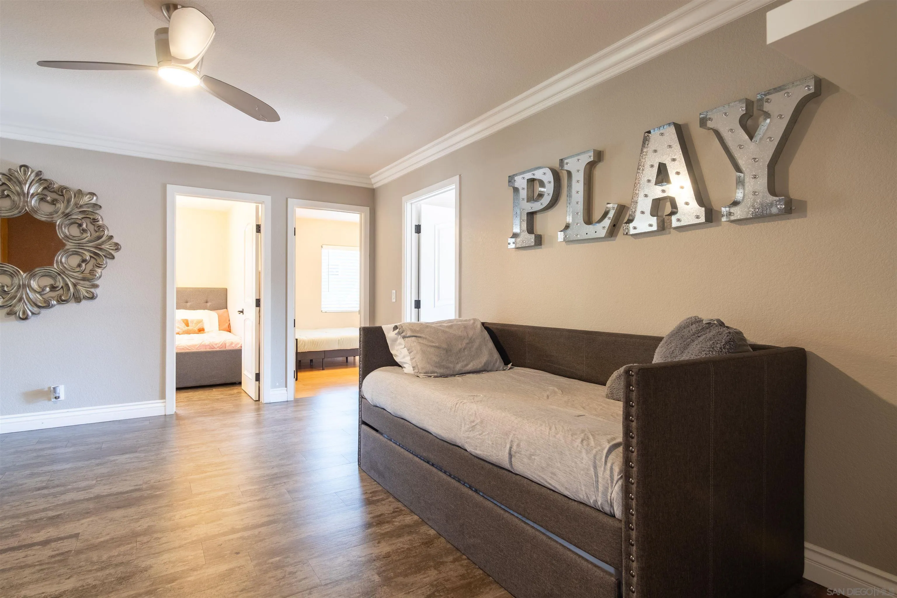 853 Crescent Drive Vista, CA 92084 - Photo 22 of 70 a bedroom with a large bed and a large window