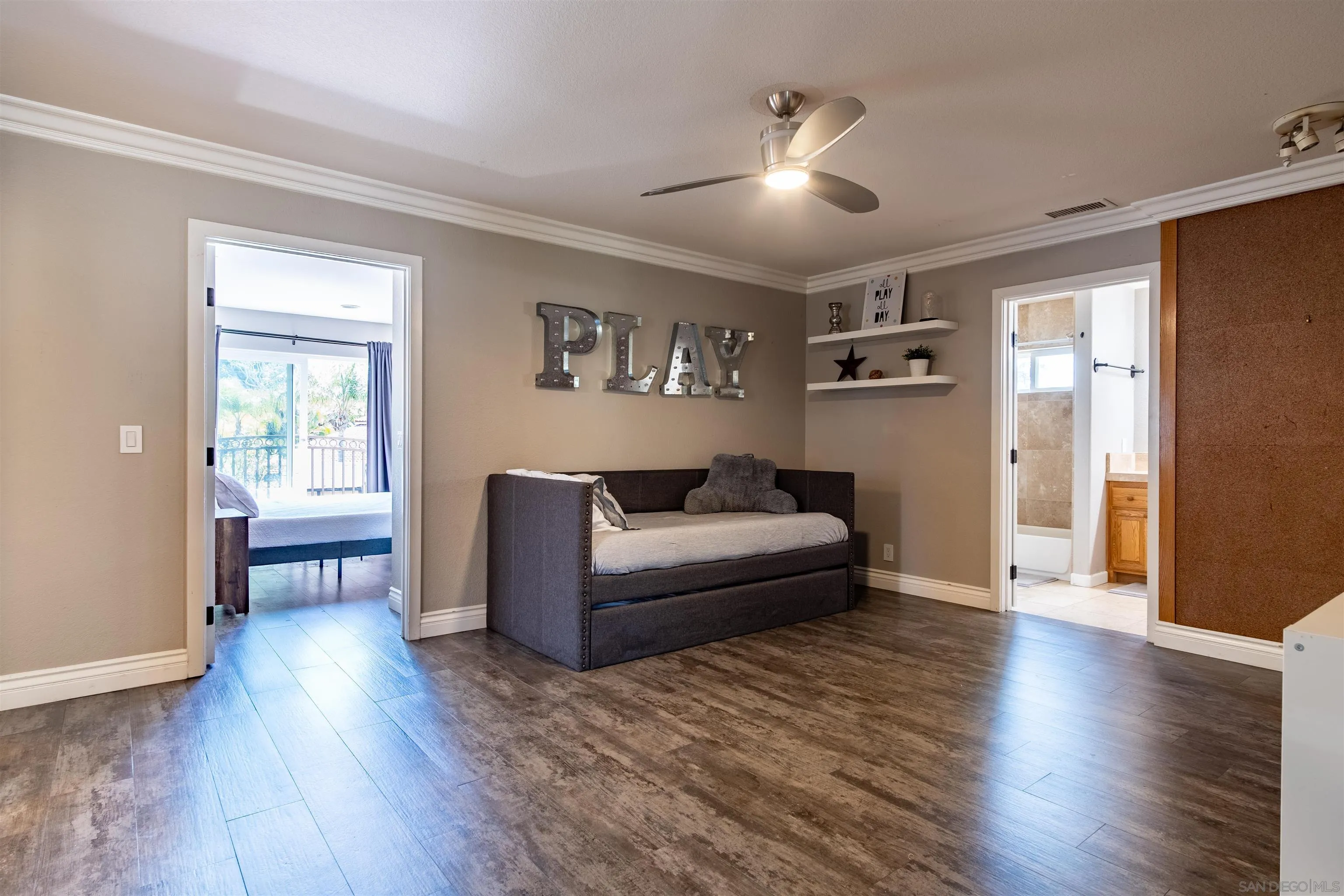 853 Crescent Drive Vista, CA 92084 - Photo 24 of 70 a living room with furniture and a wooden floor