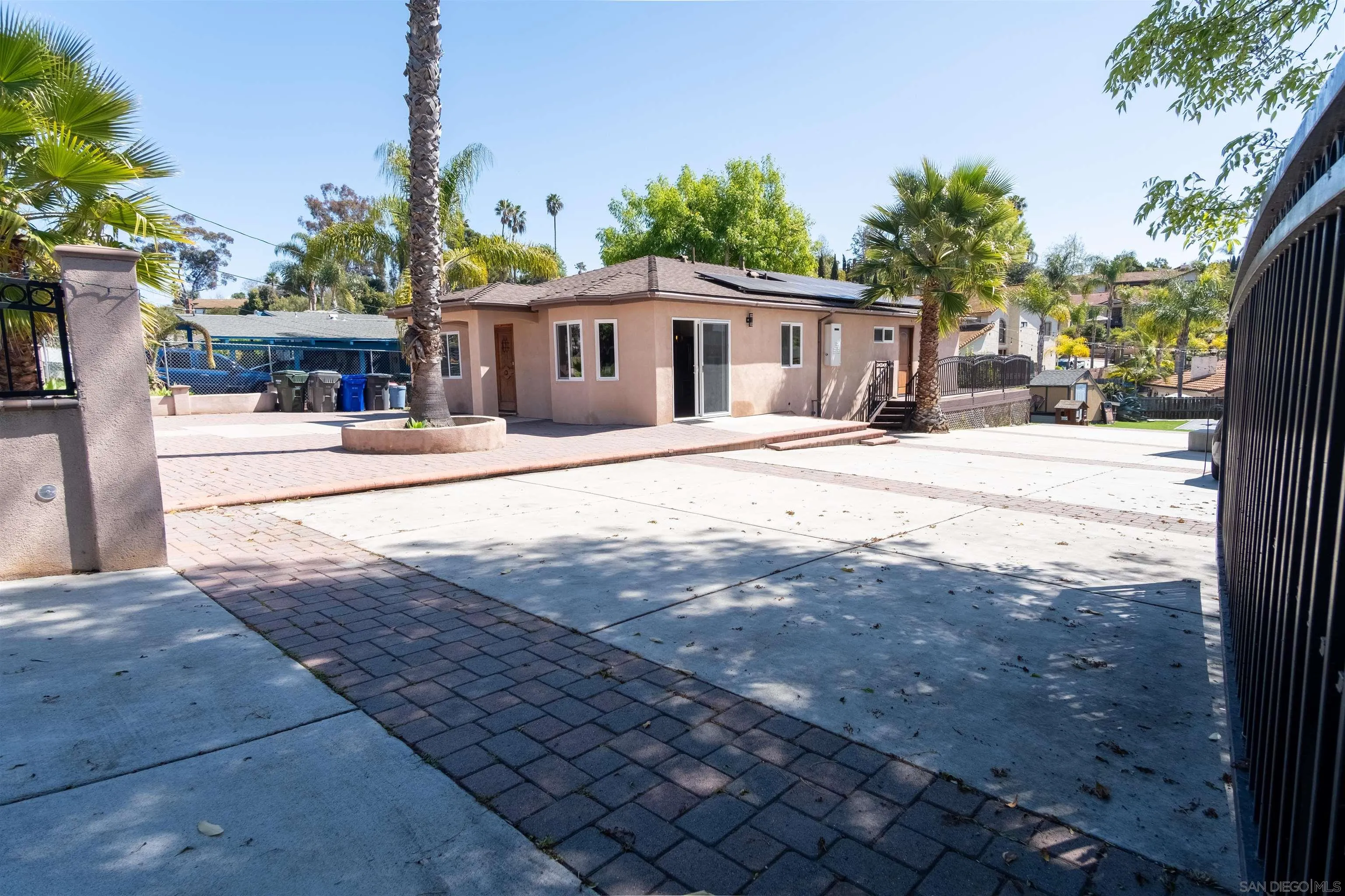853 Crescent Drive Vista, CA 92084 - Photo 35 of 70 a front view of a house with a yard and trees