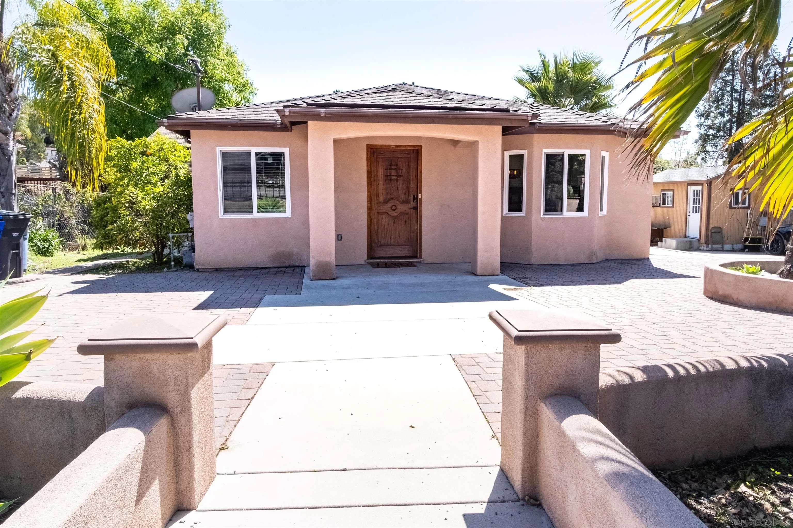 853 Crescent Drive Vista, CA 92084 - Photo 38 of 70 a front view of a house with a yard
