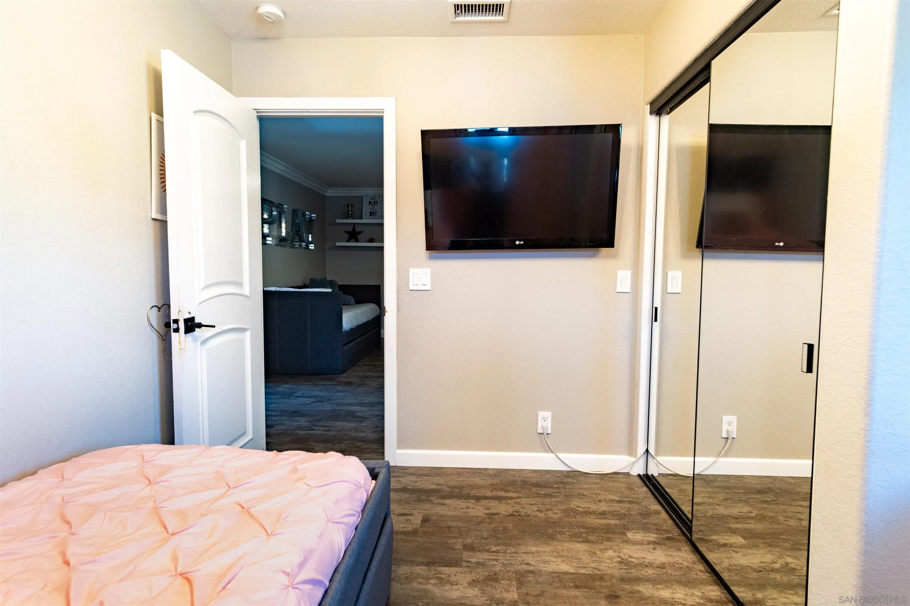 853 Crescent Drive Vista, CA 92084 - Photo 54 of 70 a bedroom with a bed and a television