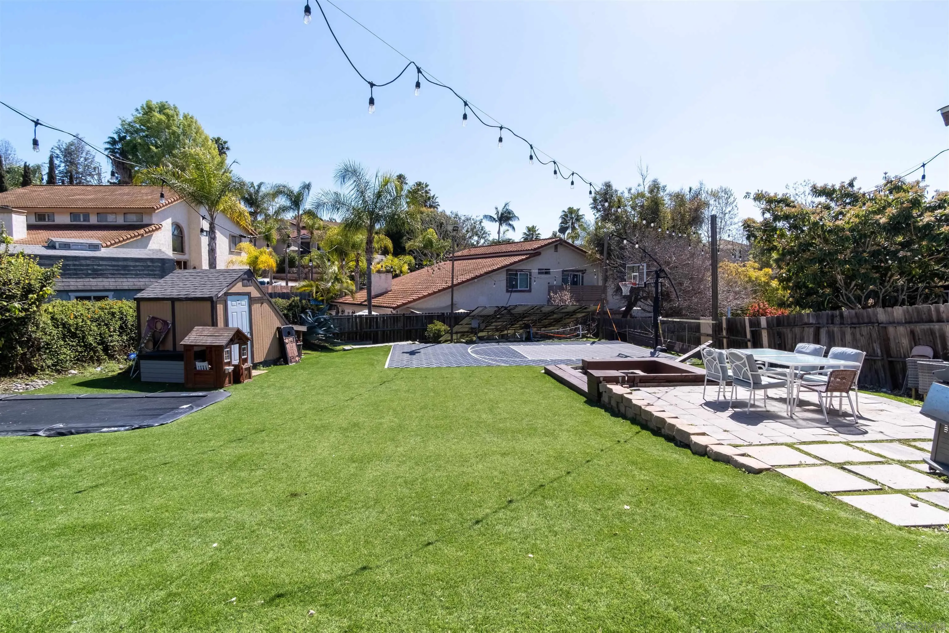 853 Crescent Drive Vista, CA 92084 - Photo 7 of 70 a view of a patio with table and chairs potted plants and large tree