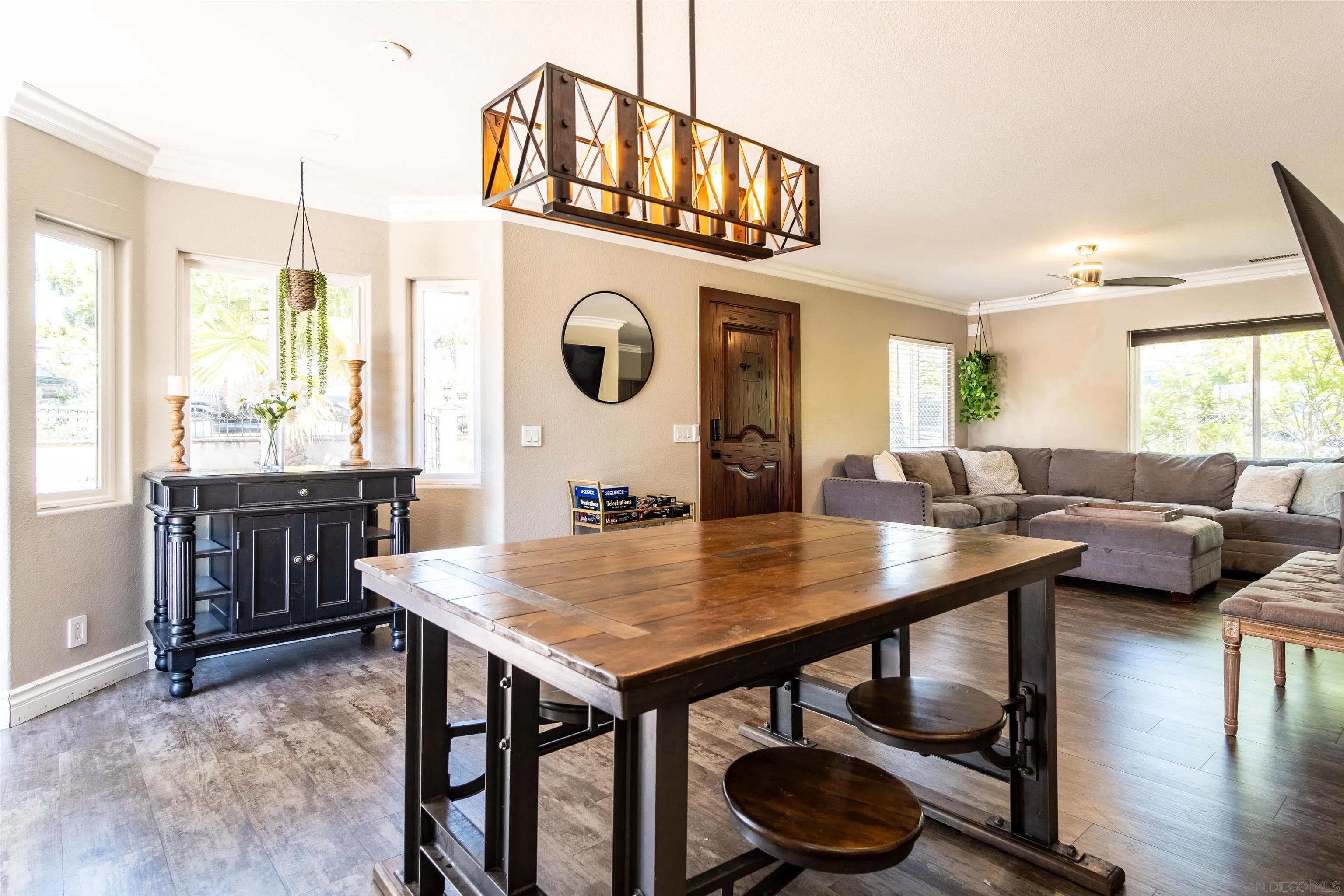 853 Crescent Drive Vista, CA 92084 - Photo 10 of 70 a living room with granite countertop a table chairs and a wooden floor