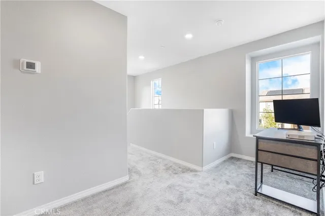 a workspace with furniture and window