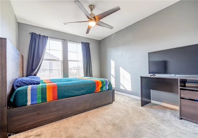a living room with furniture and flat screen tv