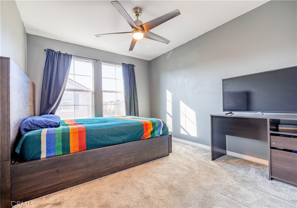 2498 Gunner Ridge Way Rialto, CA 92377 - Photo 17 of 31 a living room with furniture and flat screen tv