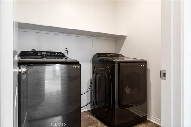 a view of swimming pool with outdoor seating and city view
