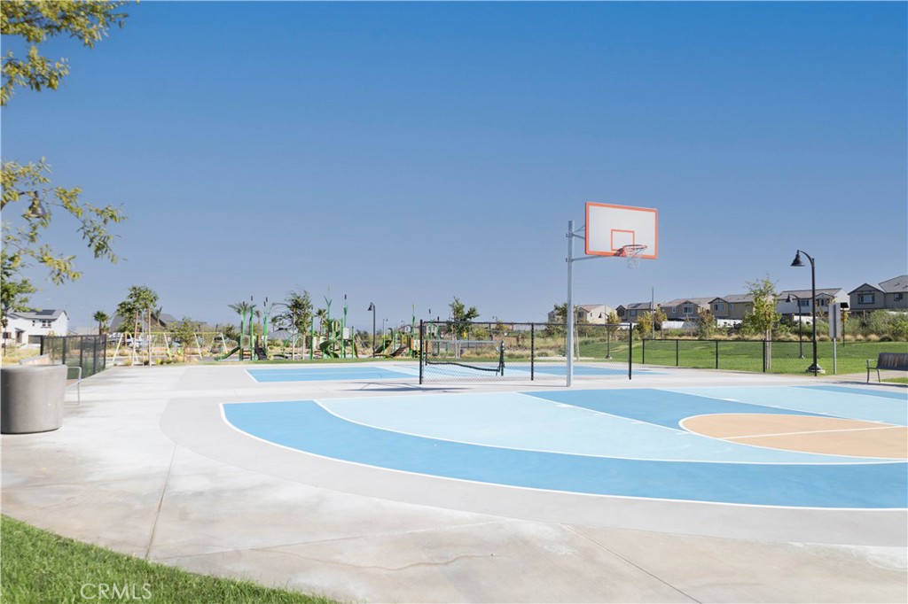 2498 Gunner Ridge Way Rialto, CA 92377 - Photo 26 of 31 a view of a swimming pool and an outdoor space