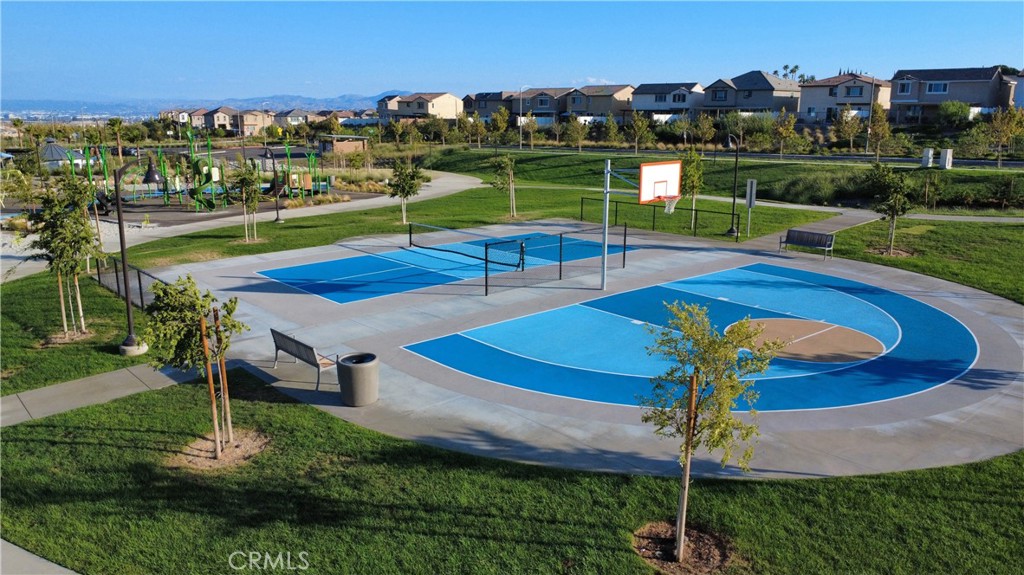 2498 Gunner Ridge Way Rialto, CA 92377 - Photo 29 of 31 a view of a swimming pool and a yard