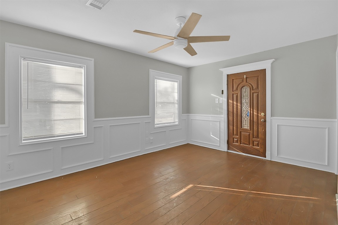 505 Garrett Street Pasadena, TX 77506 - Photo 12 of 14 wooden floor in an empty room with a window