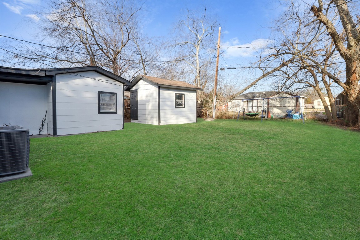 505 Garrett Street Pasadena, TX 77506 - Photo 13 of 14 a house that is sitting in the grass
