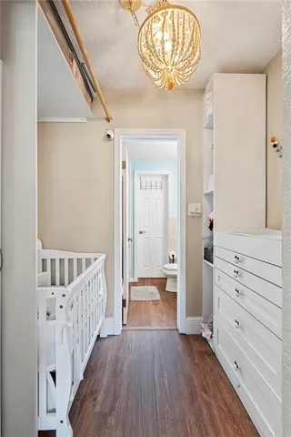 a view of room with wooden floor
