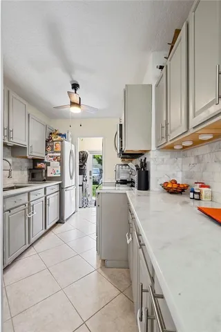 a kitchen with cabinets and appliances