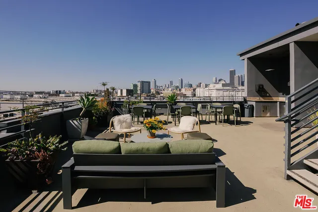 a view of a balcony with chairs