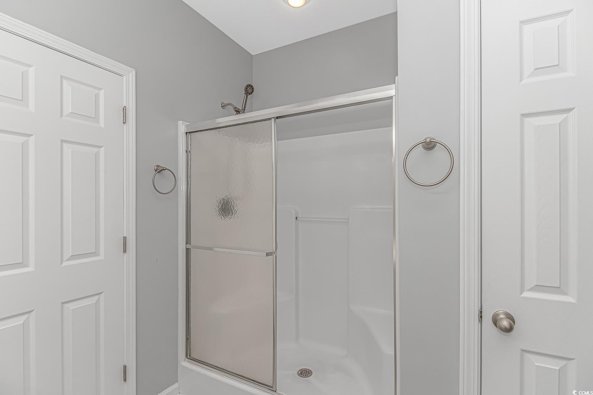 751 Painted Bunting Drive, Unit E Murrells Inlet, SC 29576 - Photo 23 of 40 Bathroom featuring a stall shower