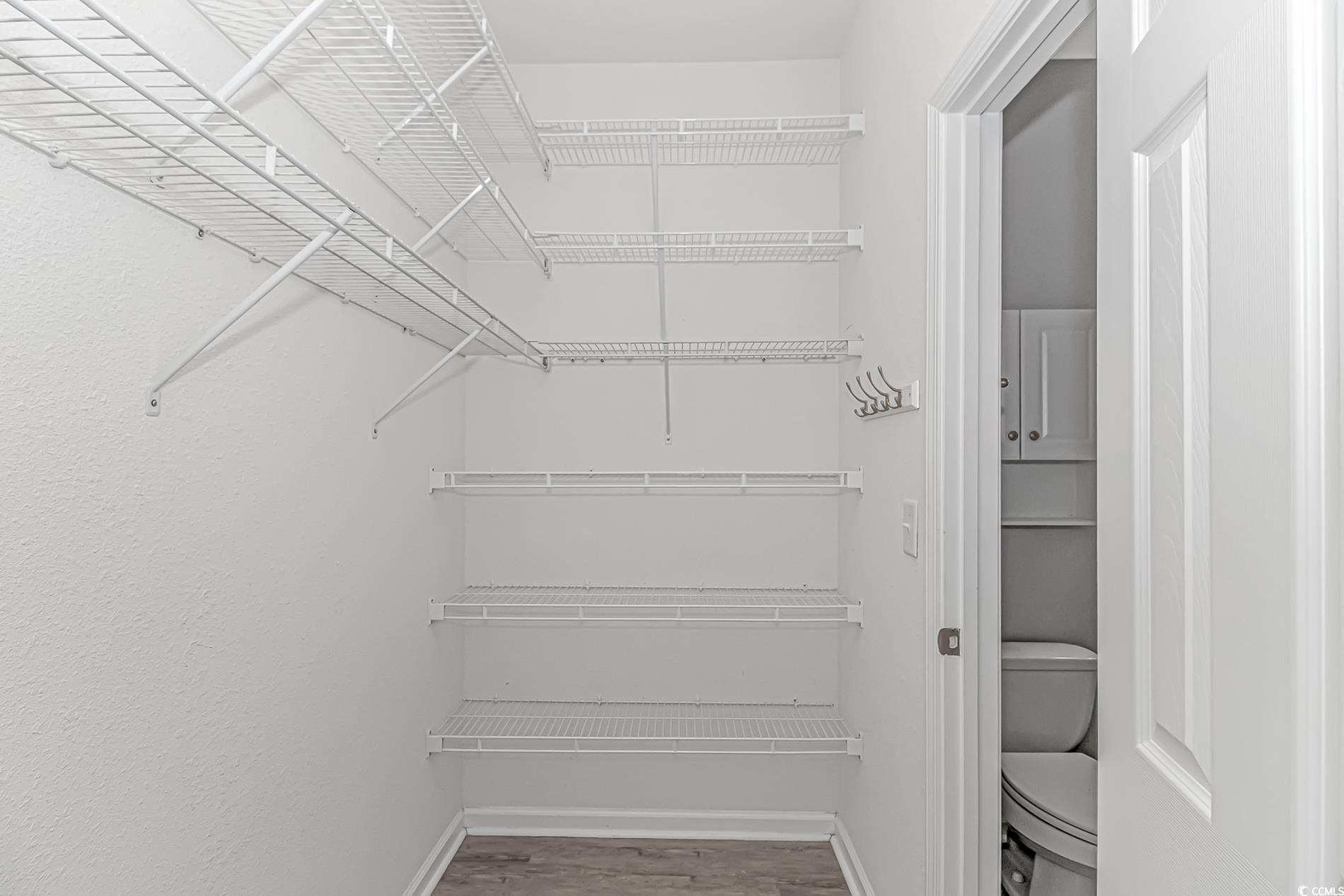 751 Painted Bunting Drive, Unit E Murrells Inlet, SC 29576 - Photo 24 of 40 Walk in closet featuring wood finished floors