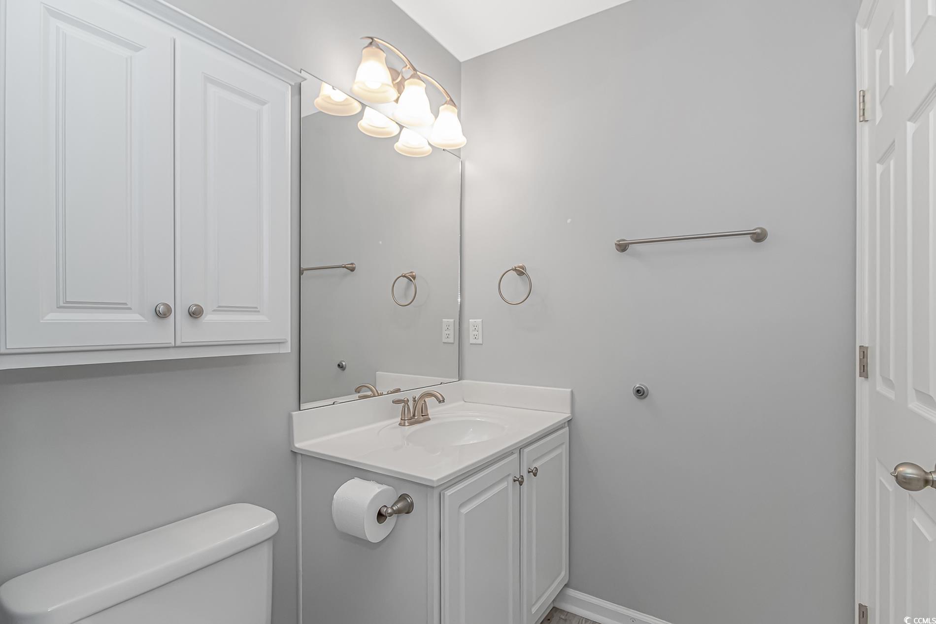 751 Painted Bunting Drive, Unit E Murrells Inlet, SC 29576 - Photo 29 of 40 Bathroom with toilet and vanity