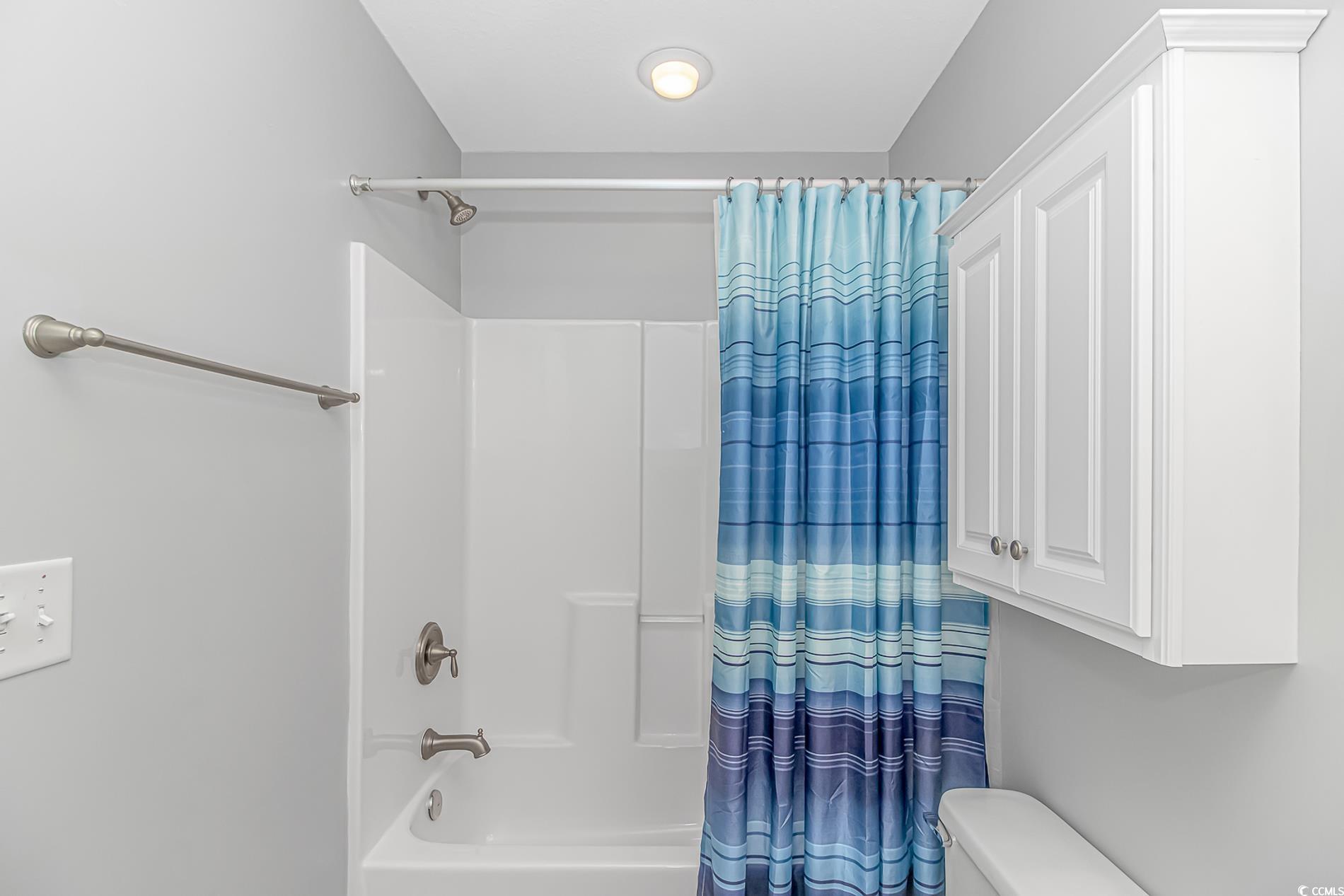 751 Painted Bunting Drive, Unit E Murrells Inlet, SC 29576 - Photo 30 of 40 Bathroom featuring shower / bath combo and toilet