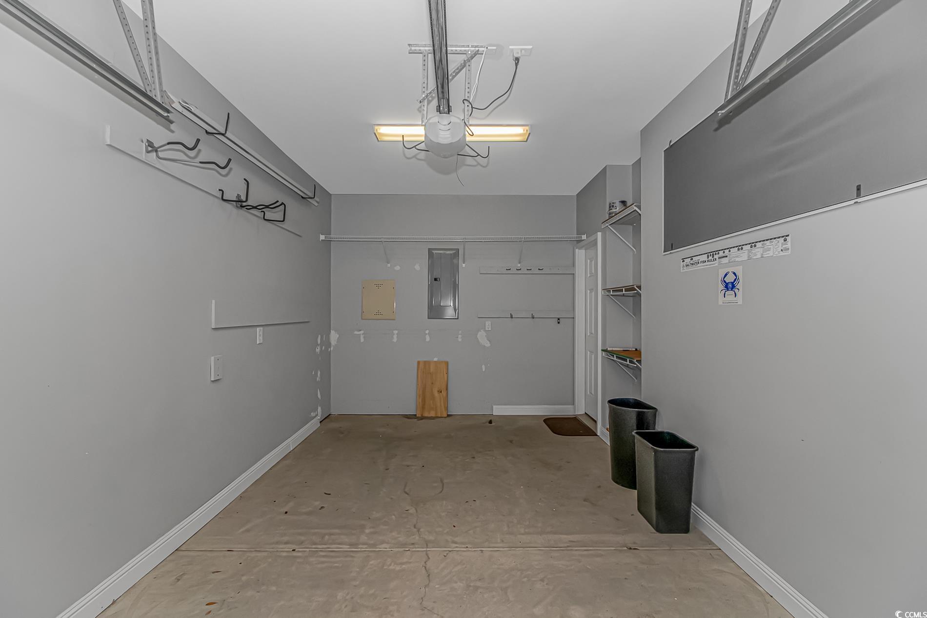751 Painted Bunting Drive, Unit E Murrells Inlet, SC 29576 - Photo 34 of 40 Garage with electric panel and baseboards