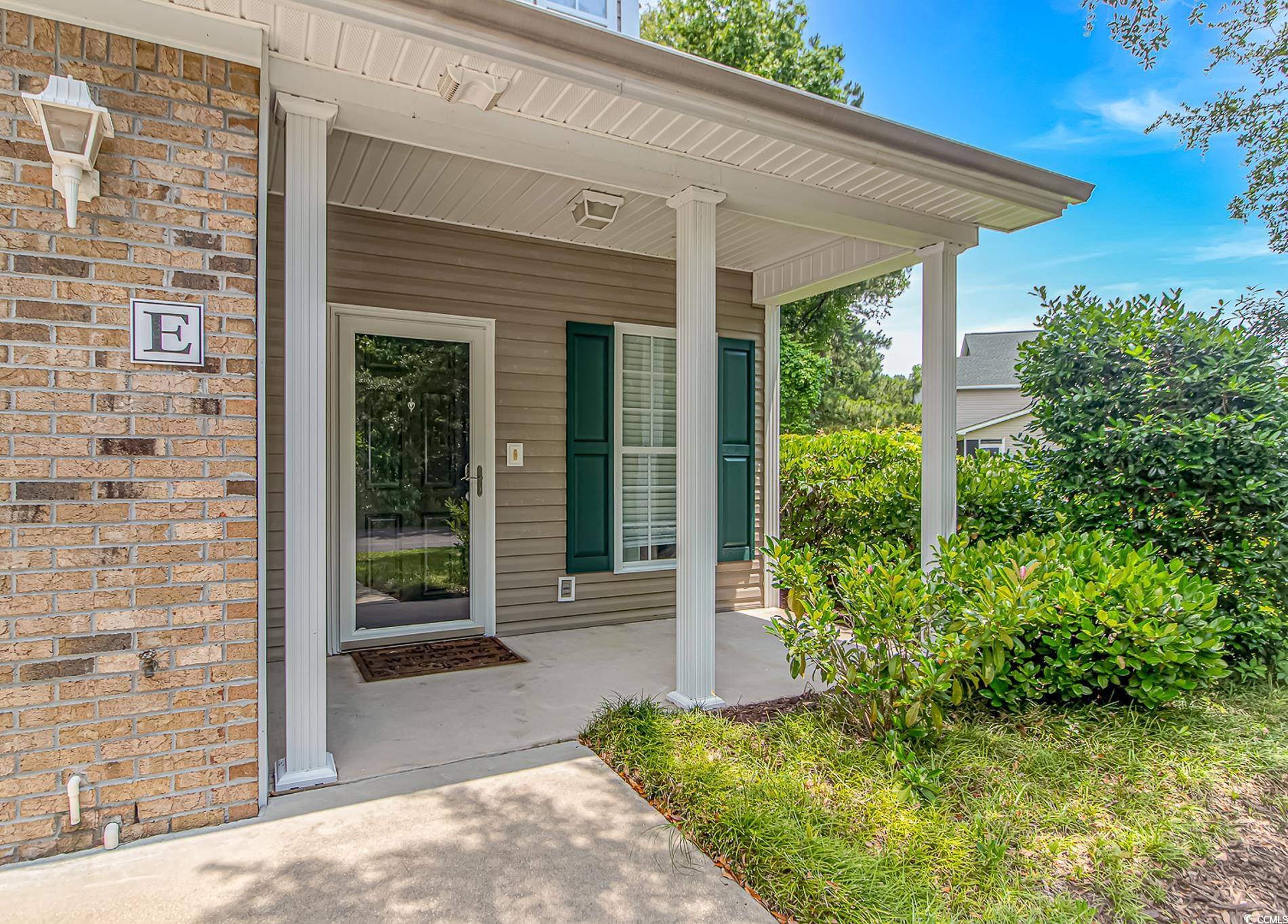 751 Painted Bunting Drive, Unit E Murrells Inlet, SC 29576 - Photo 4 of 40 View of exterior entry featuring covered porch