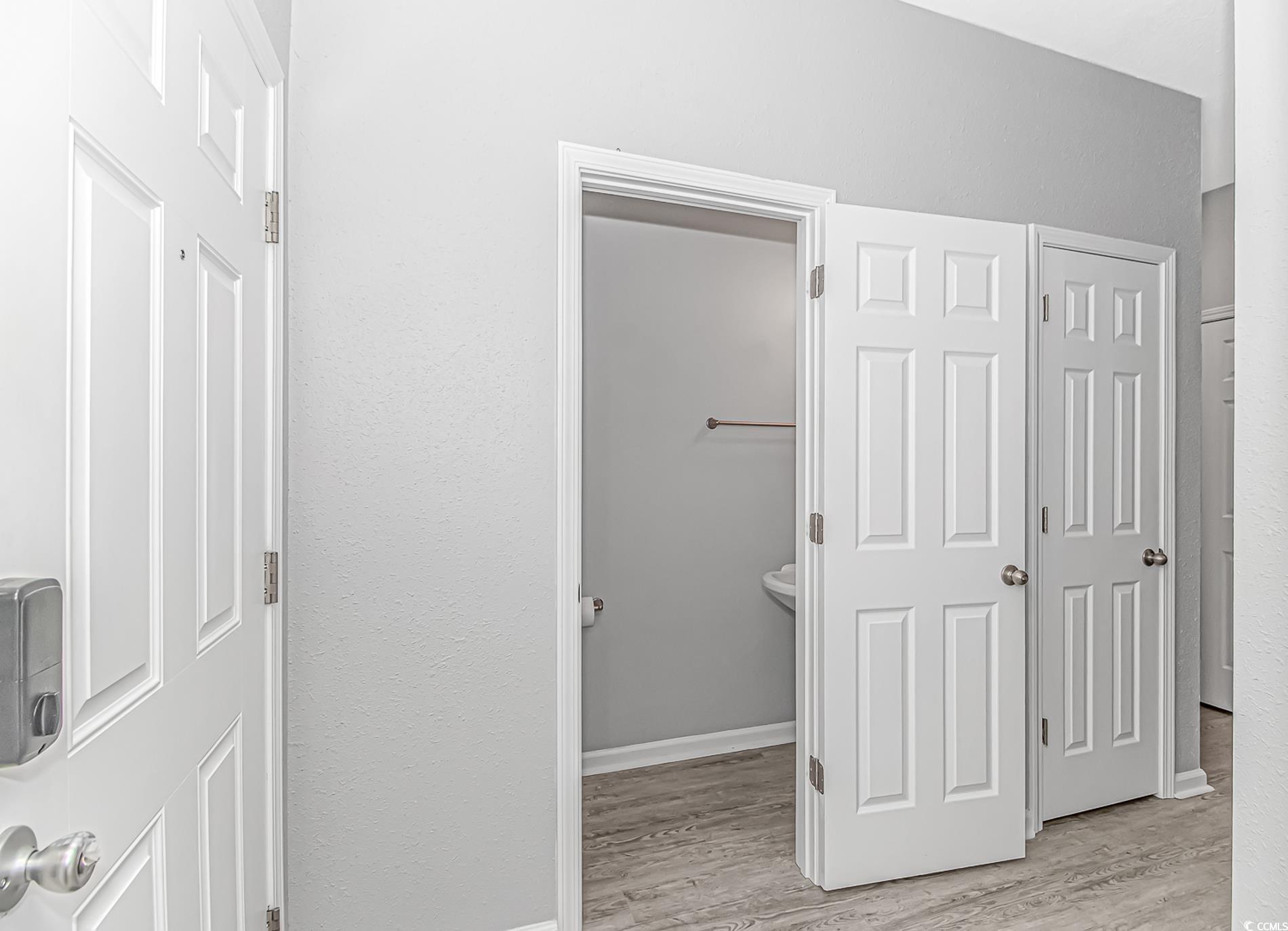 751 Painted Bunting Drive, Unit E Murrells Inlet, SC 29576 - Photo 7 of 40 Hall with light wood-style flooring and baseboards