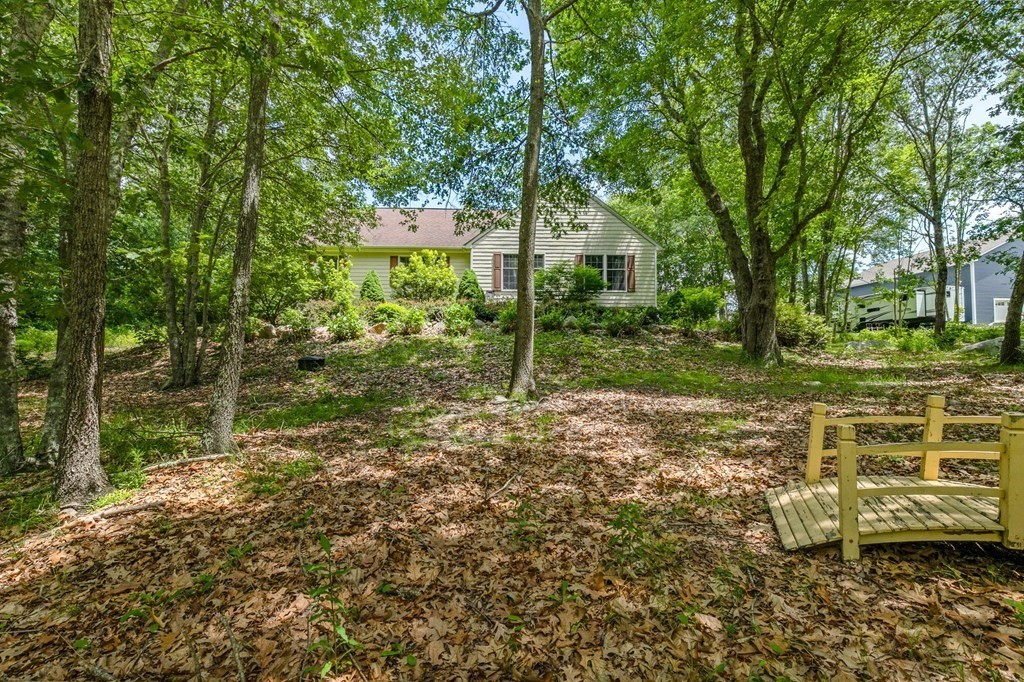 405 Neck Road Rochester, MA 02770 - Photo 29 of 36 a backyard of a house with lots of green space