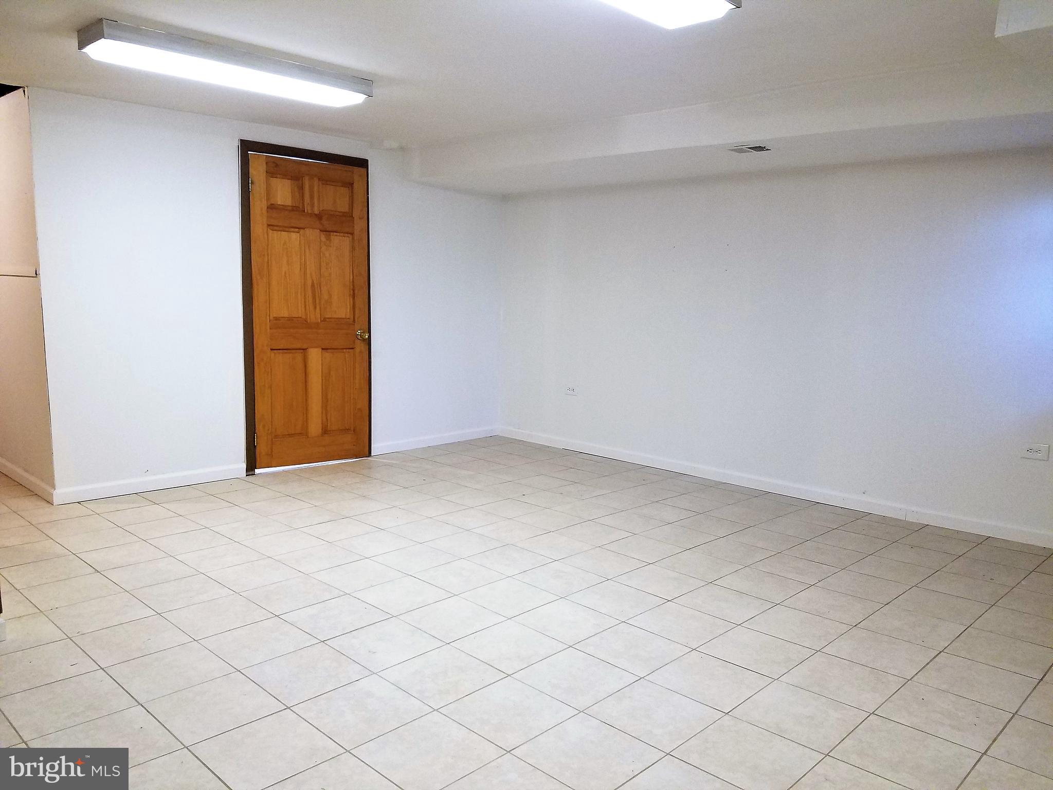 1905 Barry Road Dundalk, MD 21222 - Photo 15 of 23 a view of an empty room and wooden floor