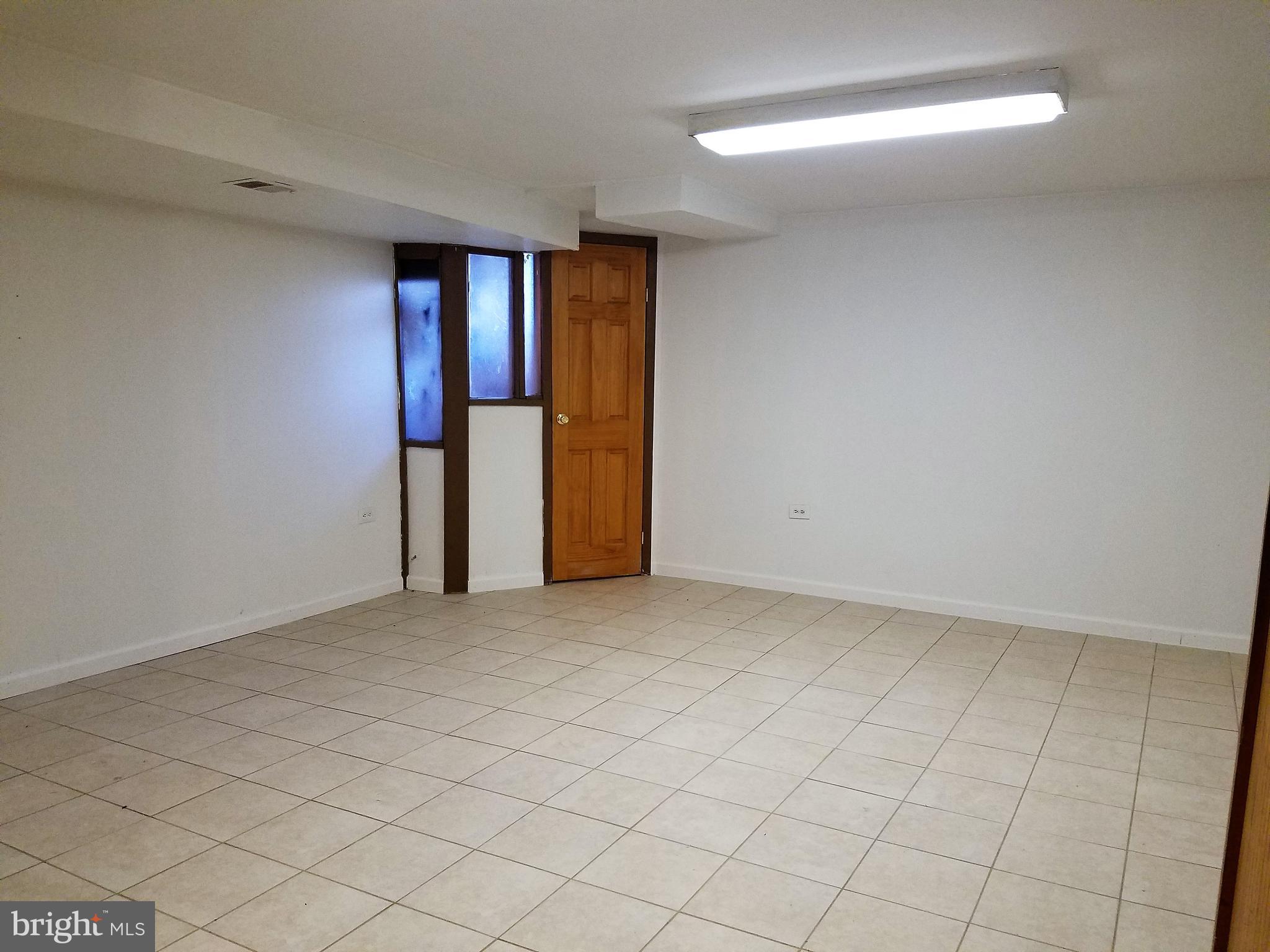 1905 Barry Road Dundalk, MD 21222 - Photo 16 of 23 a view of an empty room with a window