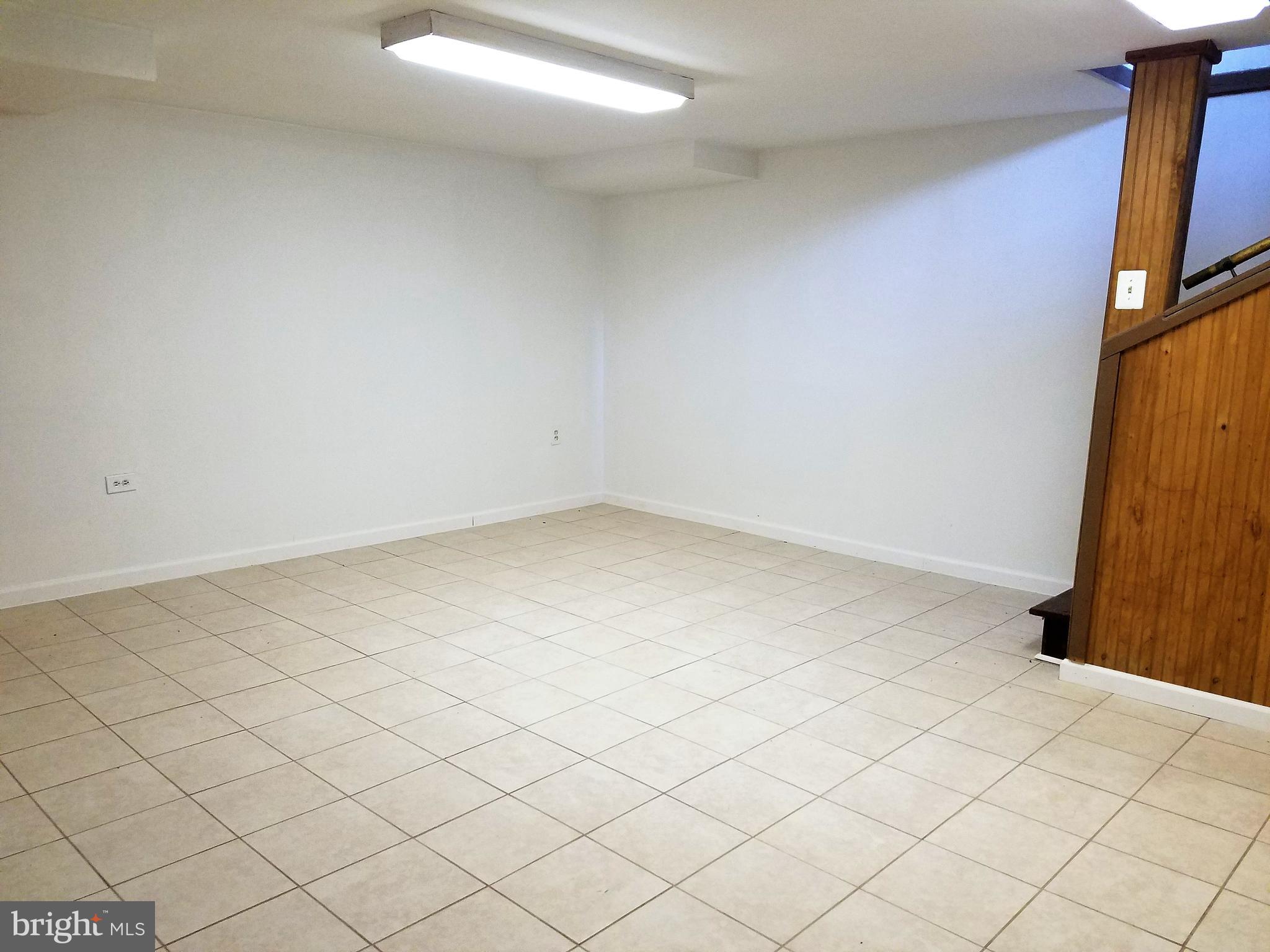 1905 Barry Road Dundalk, MD 21222 - Photo 17 of 23 an empty room with wooden floor