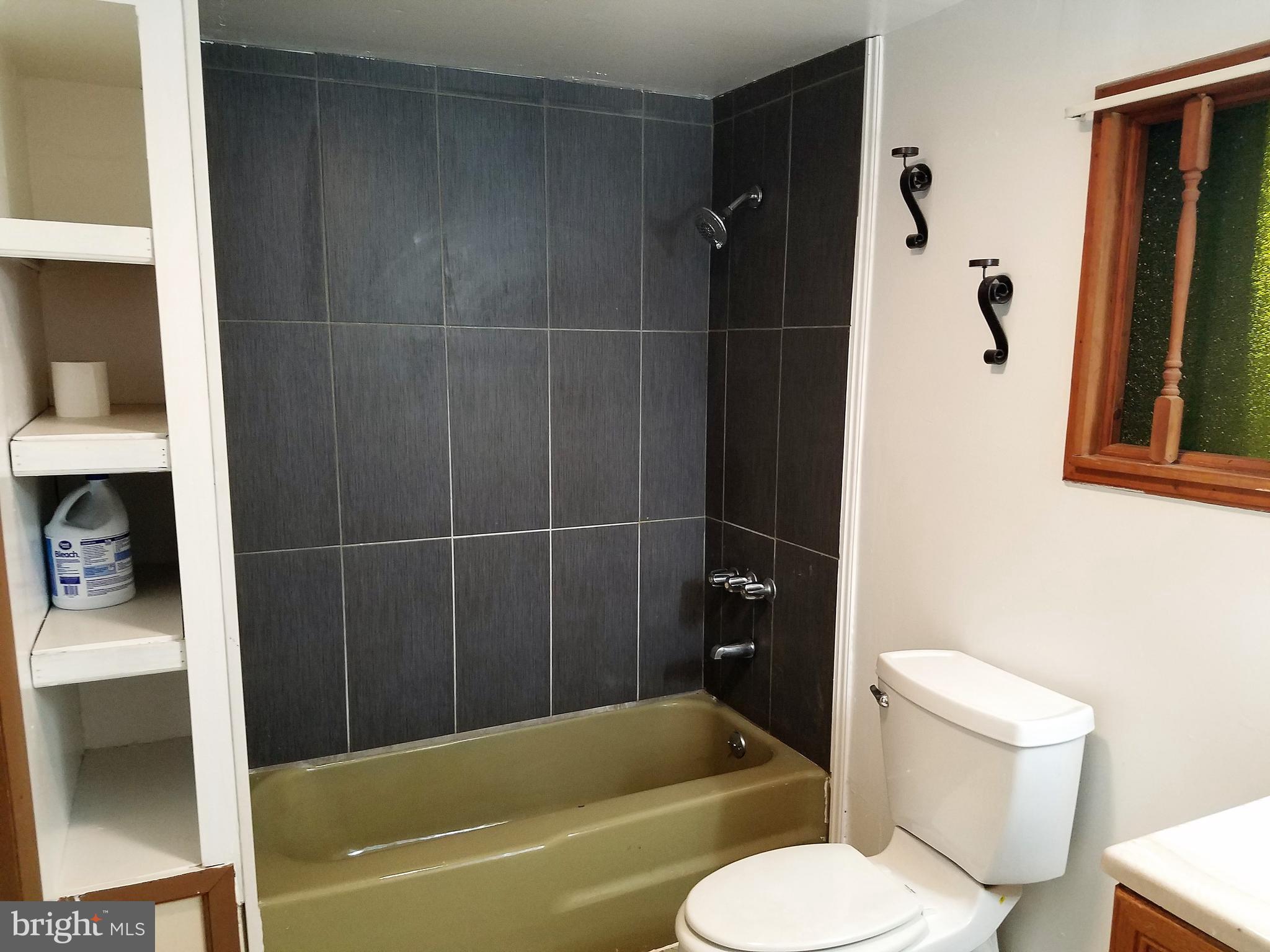 1905 Barry Road Dundalk, MD 21222 - Photo 19 of 23 a bathroom with a toilet and a bathtub