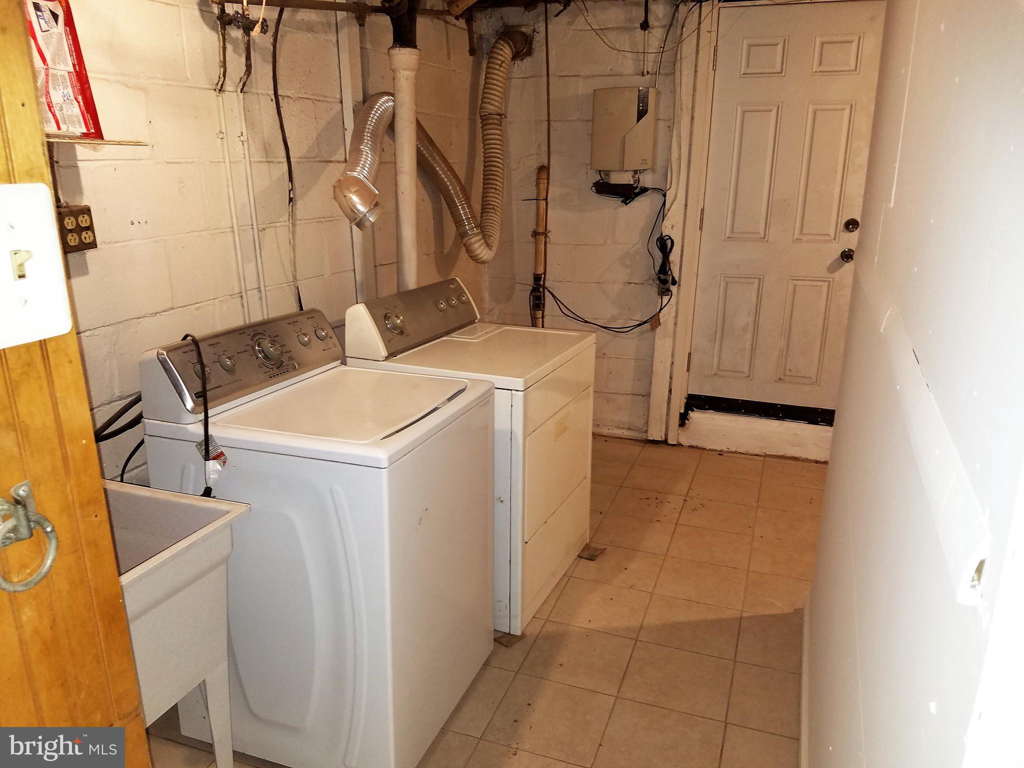 1905 Barry Road Dundalk, MD 21222 - Photo 20 of 23 a utility room with dryer and washer